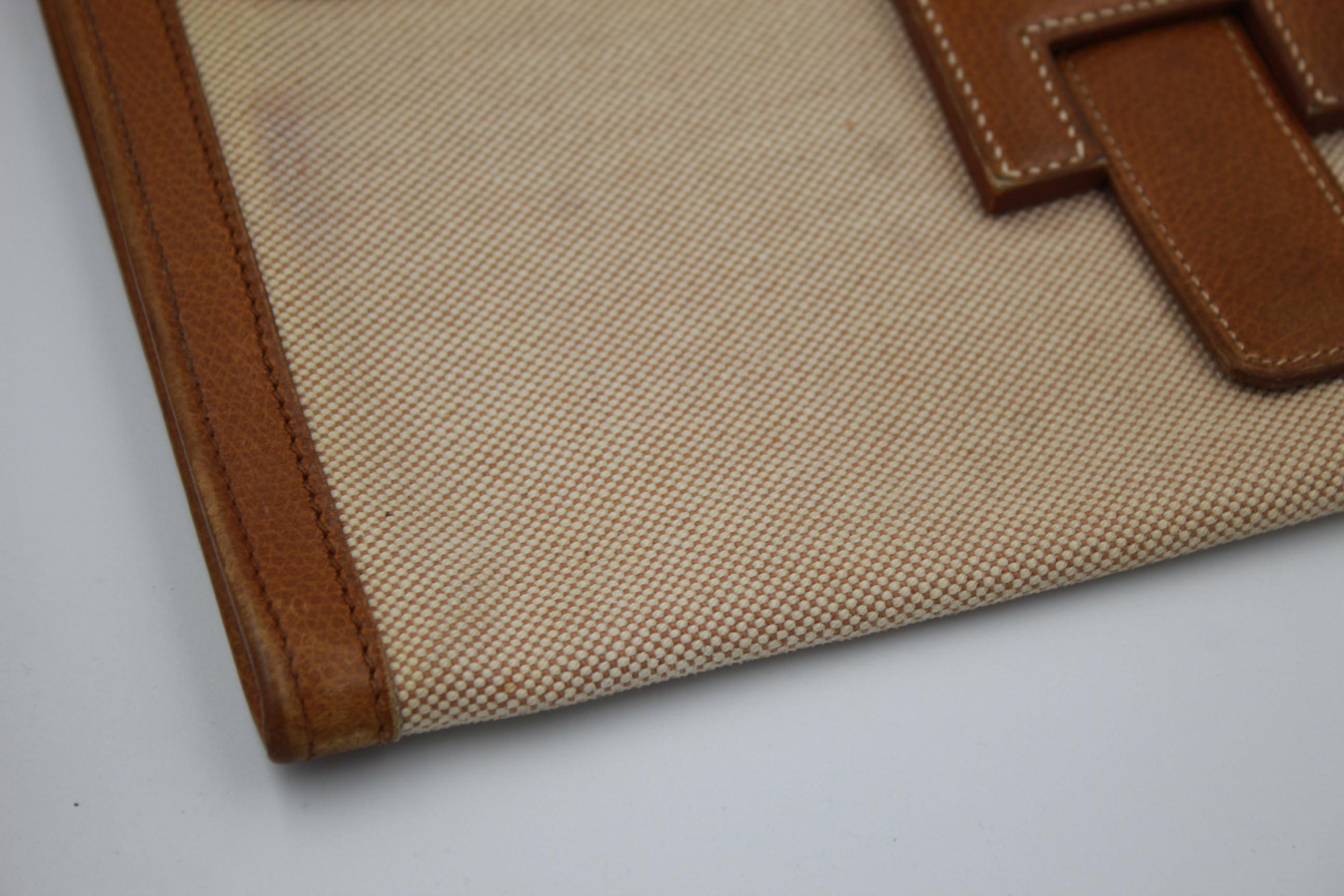 Vintage Hermes Jige MM Clutch in Canvas and Leather. In Fair Condition In Paris, FR