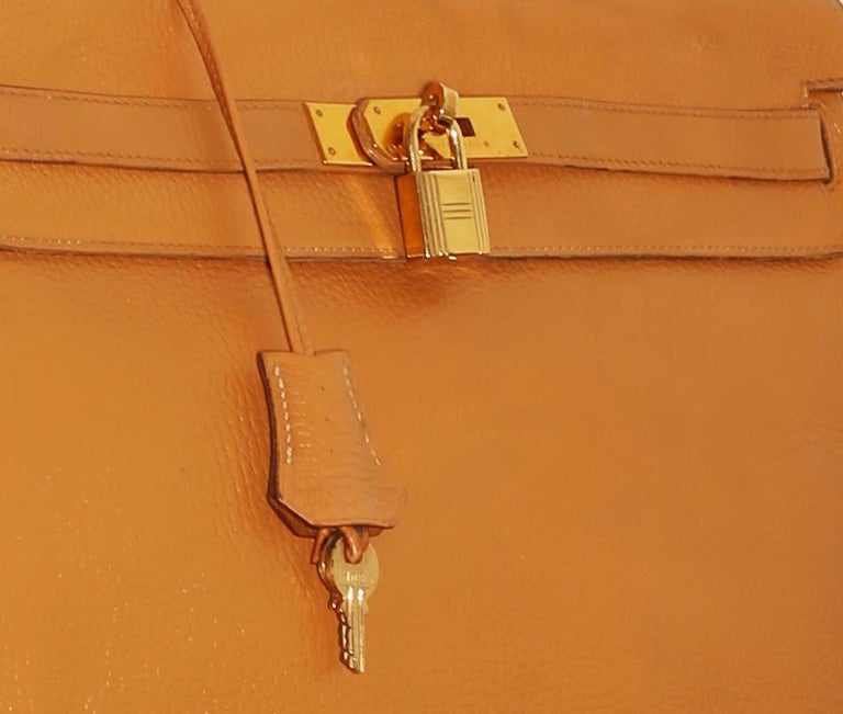 Leather and gold plated hardware handbag, Kelly 35 , Hermès, 1986