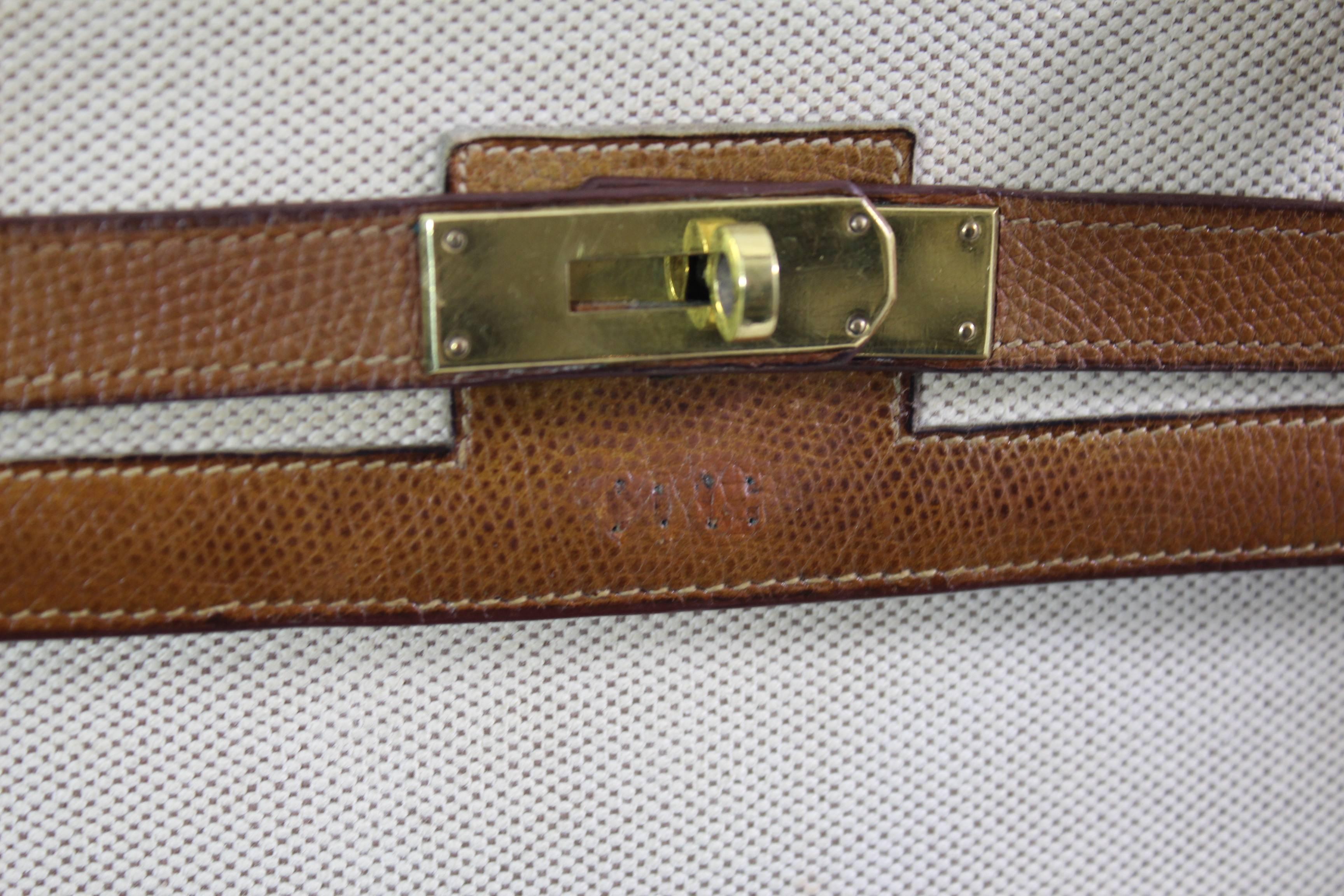 nice Vintage Hermes Kelly Sellier 35 in canvas and golden grained leather. With shoulder Hermes strap ( this strap was made years after the acquisition of the bag)

Goood condition, canvas in really good condition. Lether in the bag has been cleaned