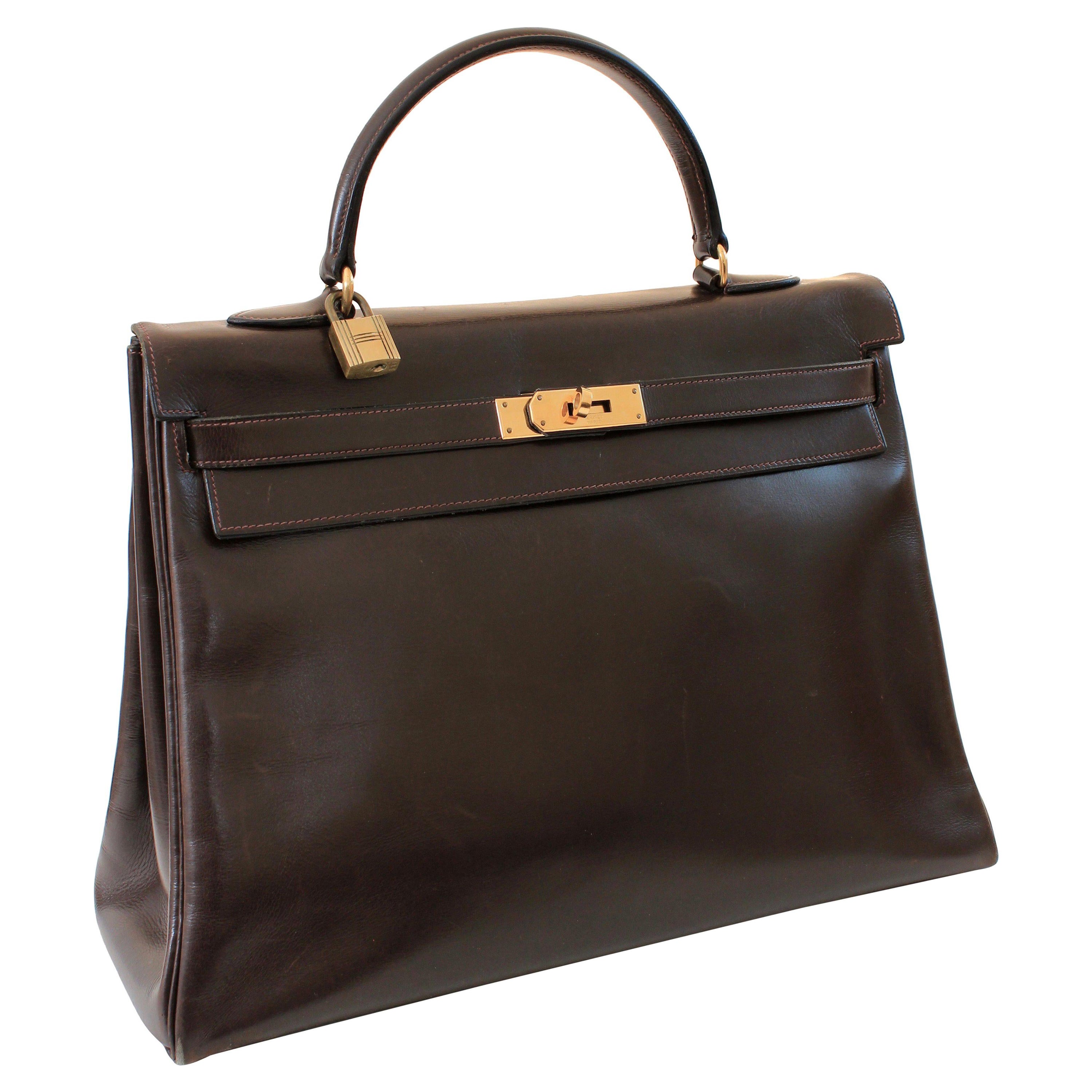 This fabulous handbag was made by Hermes in 1945.  Originally coined the Sac a Depeches - this piece was made about 12 years before Grace Kelly wore the style that we now know as the Kelly bag.  

Made from Hermes signature box leather in a deep