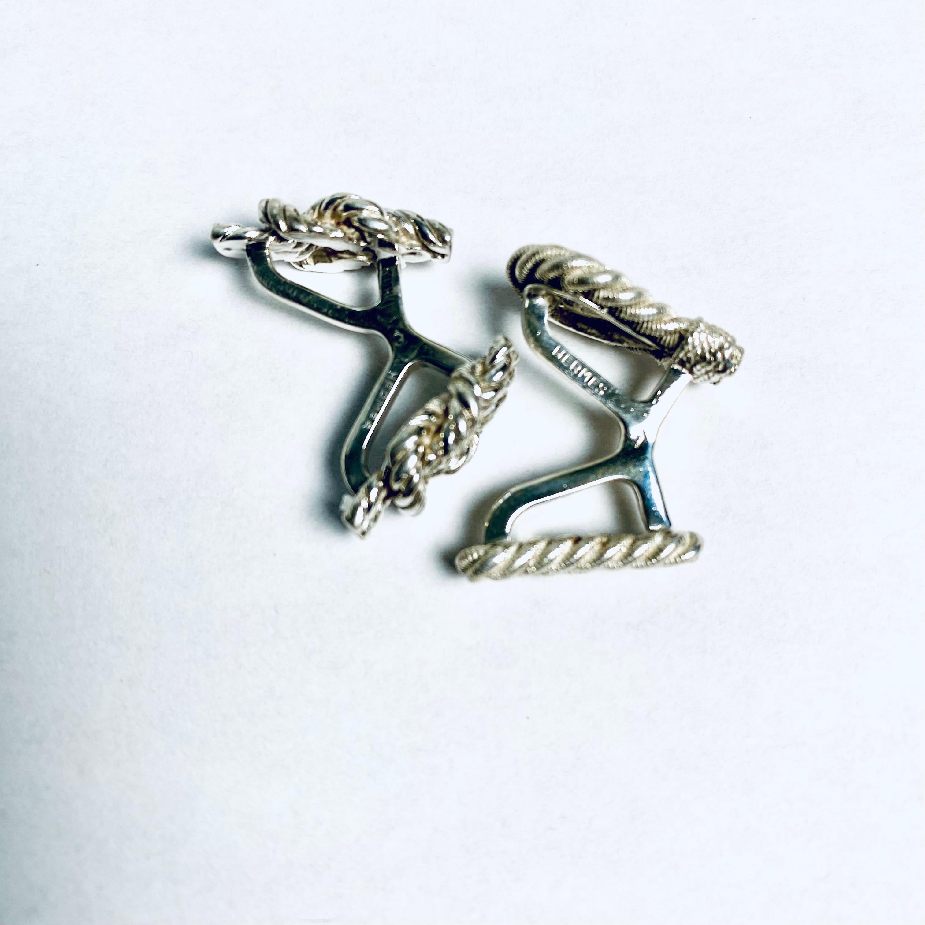 Modernist Vintage Hermès Mismatched Silver Cufflinks Stylizing Sailor Knots Twisted Loop For Sale