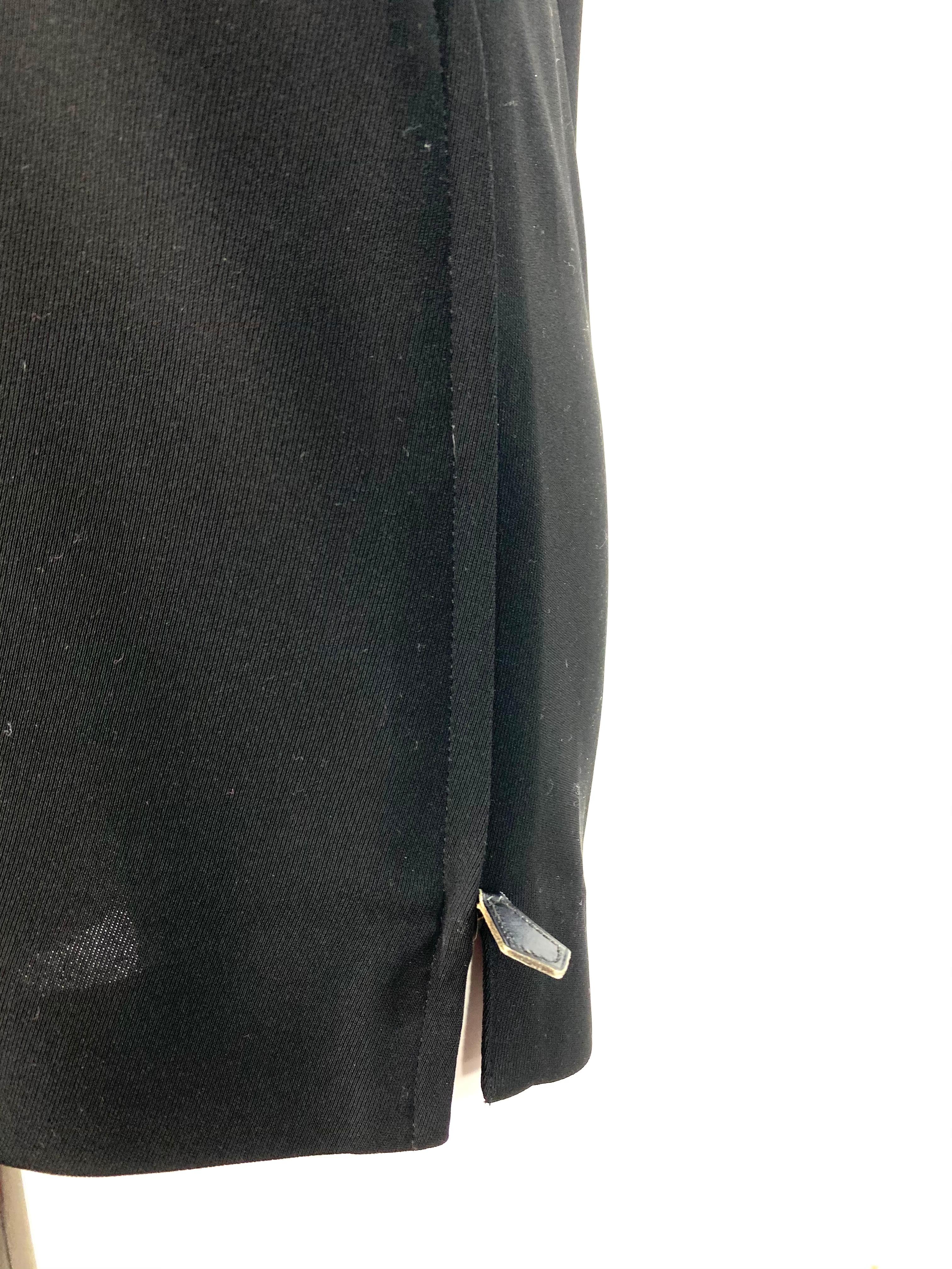 Product details:

Black polyester with silk lining dress designed by Hermes, featuring  zipper detail on both sides, 3/4 sleeve length and crew neck line.
Made in France.