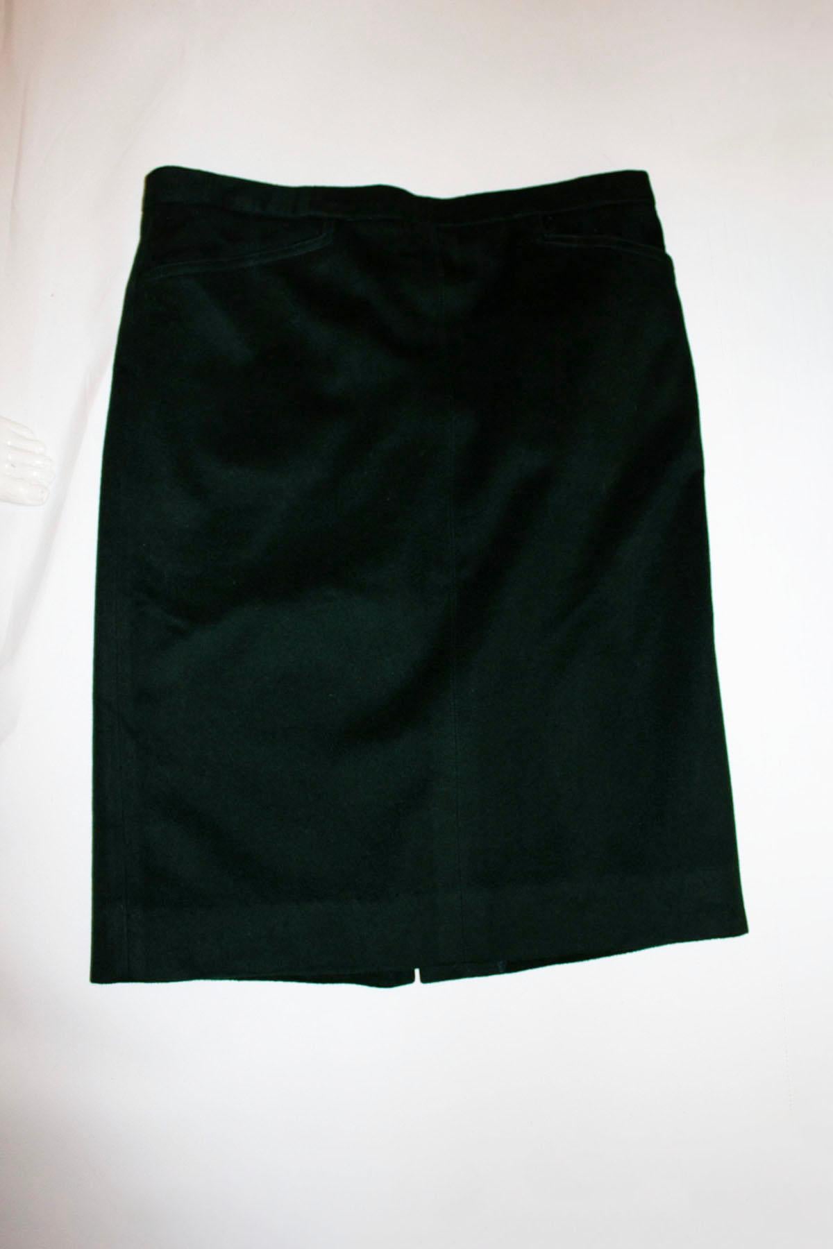 A wonderful vintage green wool skirt by Hermes, Paris.
As you would expect the fabric is of a high quality. The skirt has two pockets and is fully lined. 
Size 40, Measurements: waist 34''.  length 25''