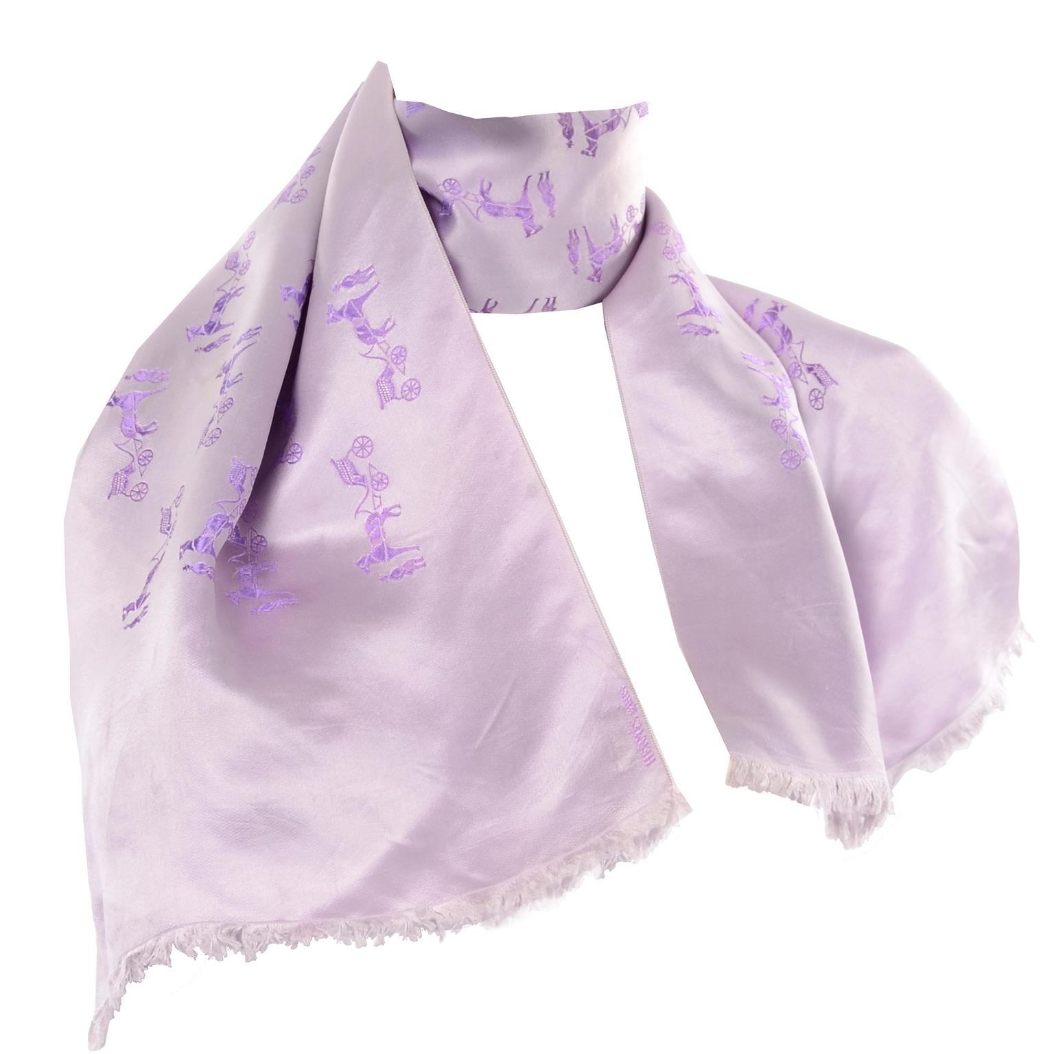 This is a rare older vintage men's Hermés silk jacquard scarf with a horse & carriage design. The scarf is purple on one side and lilac on the other.  Made in France. 100% Silk. Unisex scarf that can be worn around suit lapels or tucked in.
LENGTH: