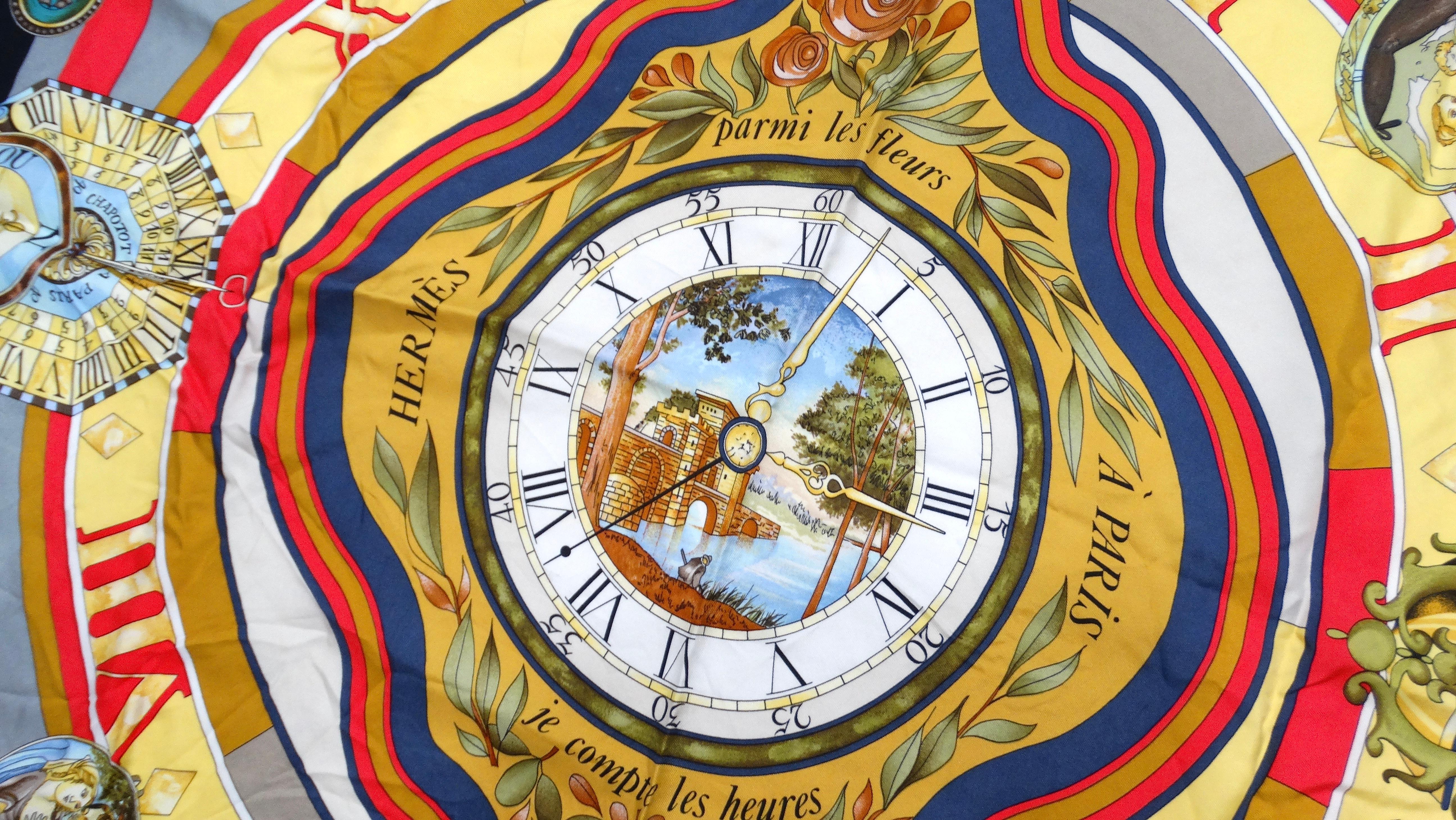 The Vintage Hermes Parmi Les Fleurs clock print scarf is a stunning accessory that marries elegance with artistic flair. Featuring a captivating blend of red, black, grey, and gold, the scarf showcases intricate clock and compass motifs interlaced