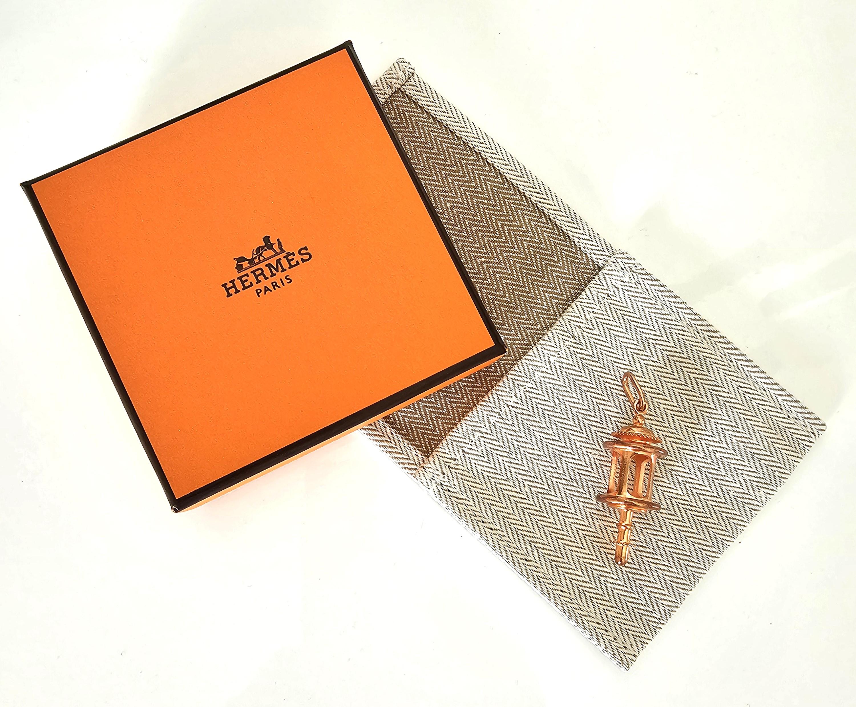 Vintage collectors item. Charming and lovely Hermes charm pendant, model Carriage Lantern issued from the collection Curiosite in a lovely pink gold palette (copper). You will adore it. To add to your keyring, chain necklace,  bracelet, as breloque,