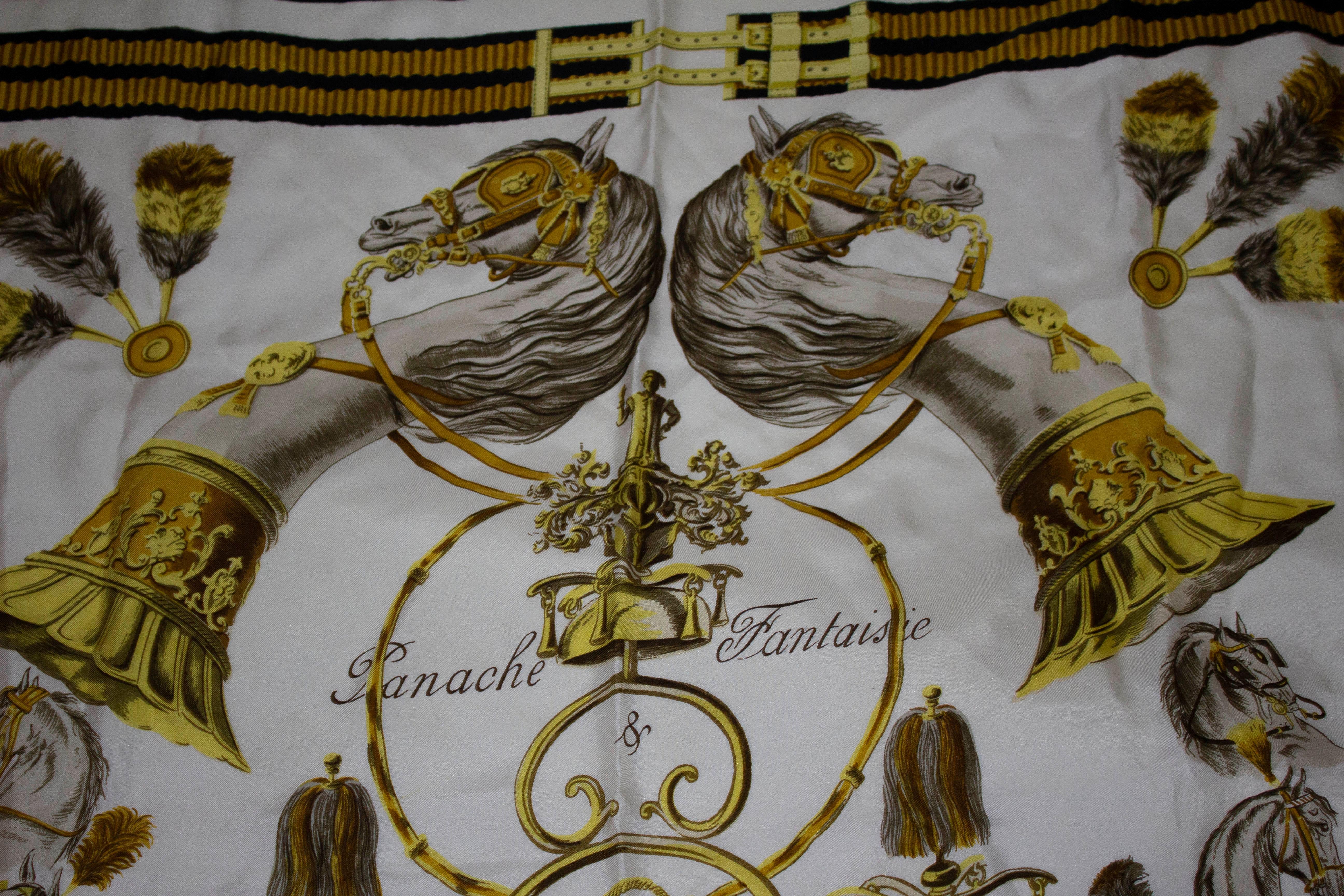 A charming vintage Hermes silk scarf, Panache Fantasie. The scarf has a black border.