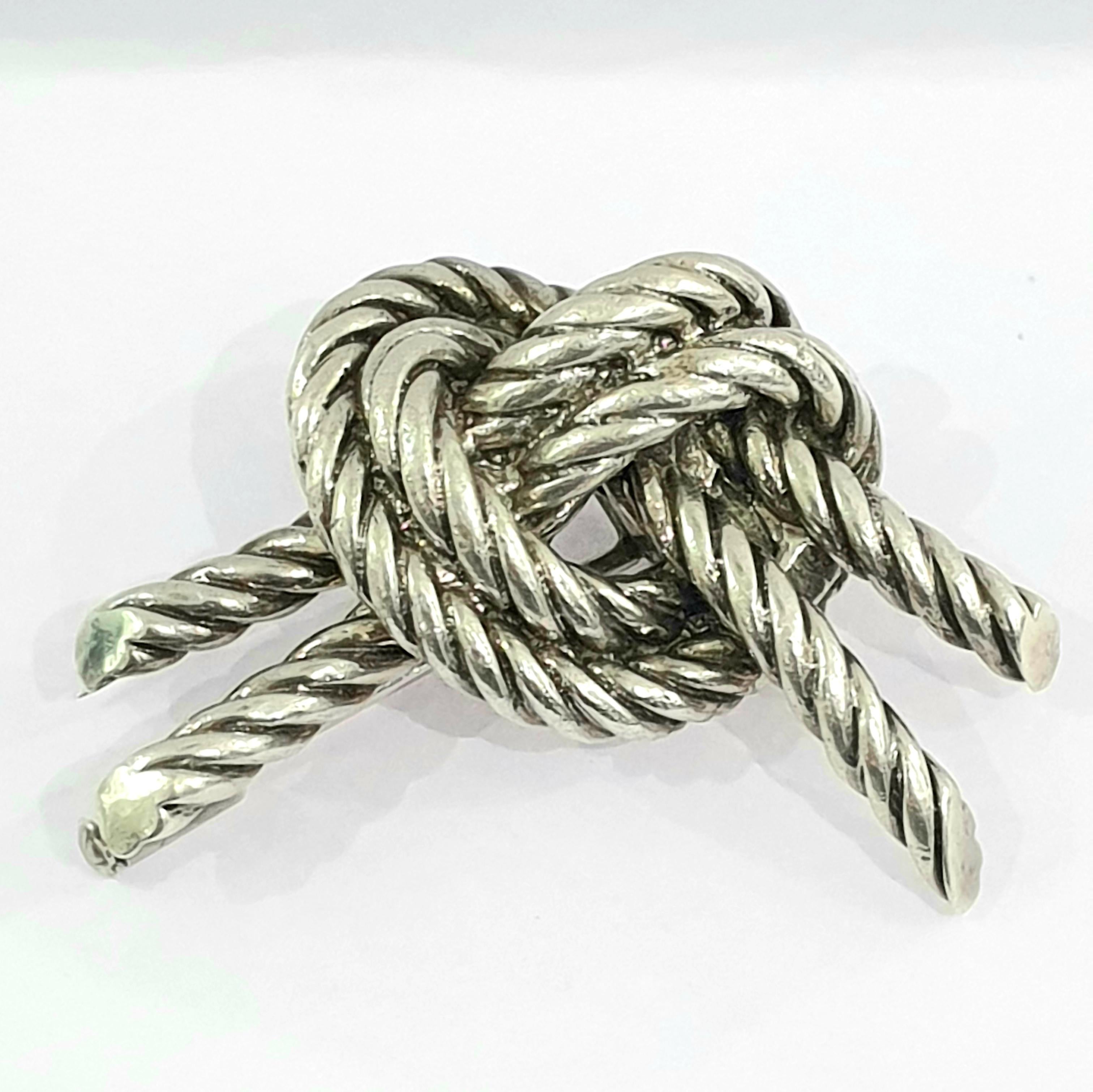 Vintage 1950's Hermes Twisted knot brooch with safety pin. You need to pull out the little screw at the end and you can push the pin in.  It is signed and hallmarked .Comes with original box. Weight:21.3gr