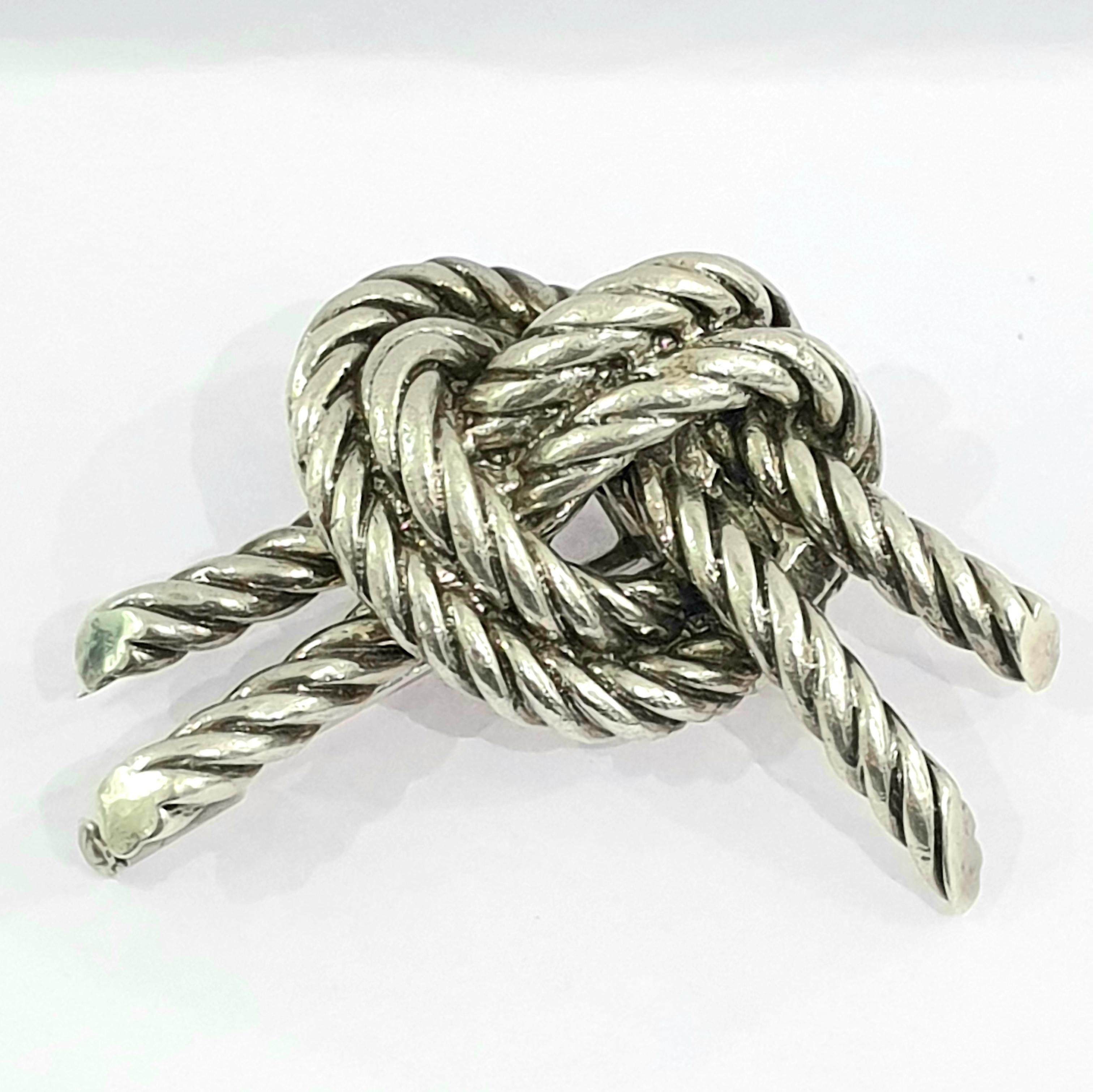 Vintage 1950's Hermes Twisted knot brooch with safety pin. You need to pull out the little screw at the end and you can push the pin in.  It is signed and hallmarked .Comes with original box. Weight:21.3gr