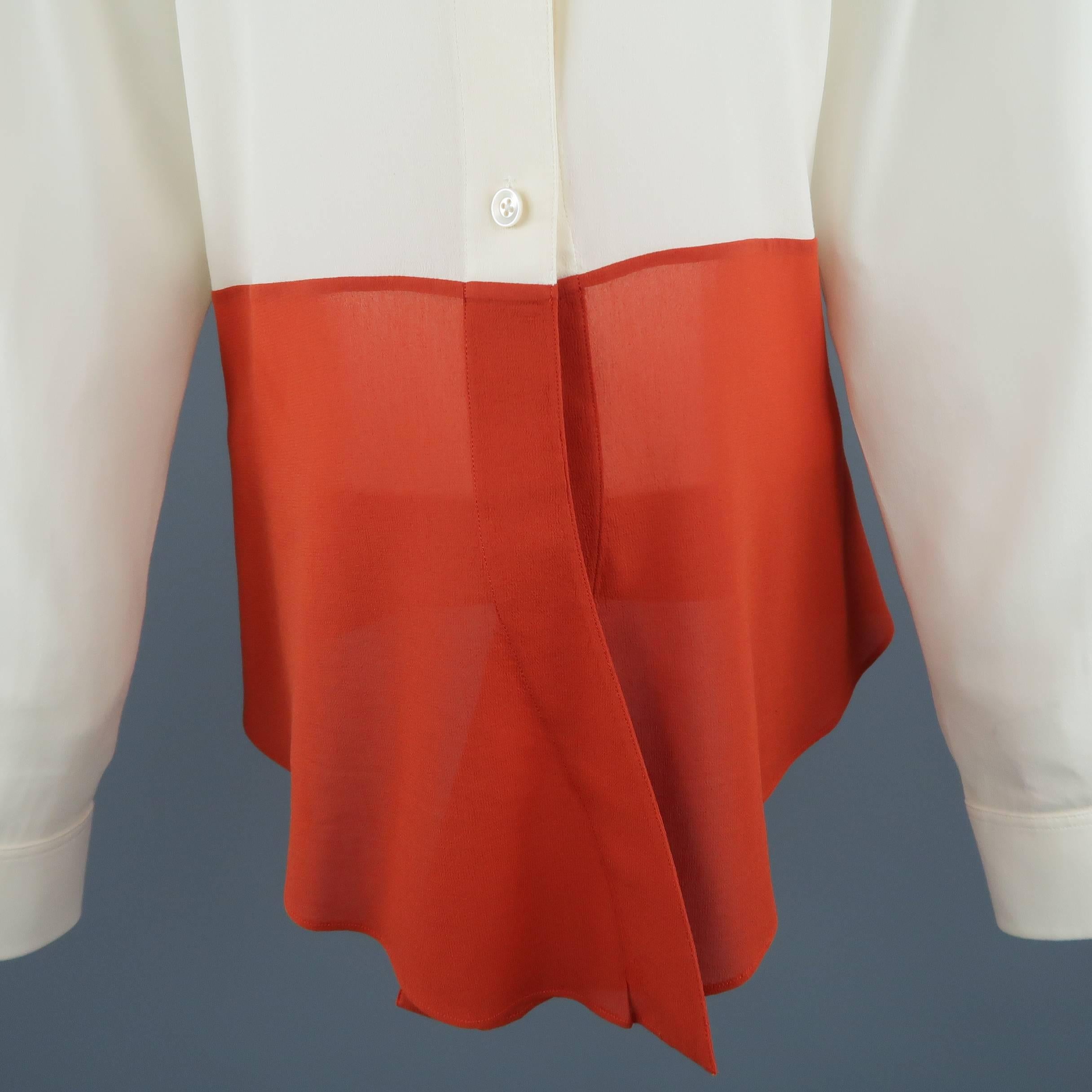 Vintage HERMES blouse comes in light beige silk crepe chiffon and features a pointed collar and burnt orange color block panel. Very faint discoloration shown in detail shot. As-is. Made in France.
 
Good Pre-Owned Condition.
Marked: FR 40
