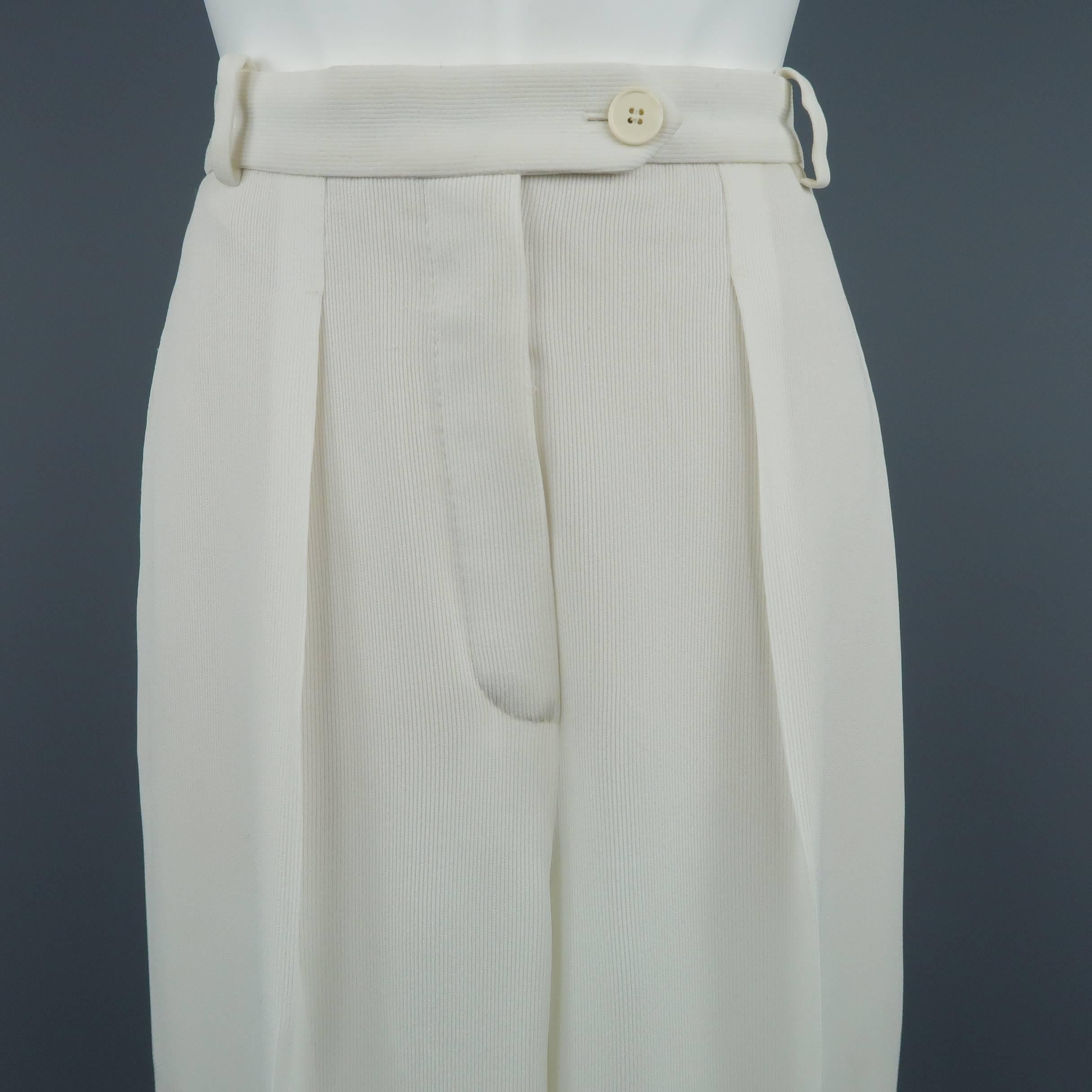 Vintage HERMES trousers come in a ribbed textured semi sheer cream viscose with a high rise, single pleat front, and relaxed wide leg fit. Fully lined. Minor wear throughout. As-is. Made in France.
 
Good Pre-Owned Condition.
Marked: FR 40
