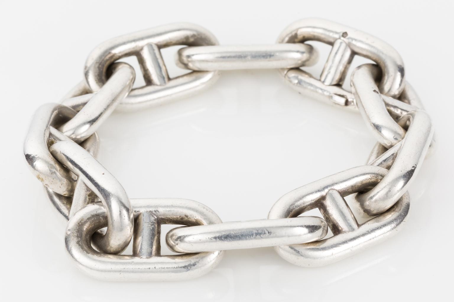 Hermes and Vintage - a great combination! This sensational anchor link chain in crafted from sterling silver and has such a heavy and bold look to it. 
Sits nicely on the wrist despite it being over 110 grams of solid silver.
A sought after style,
