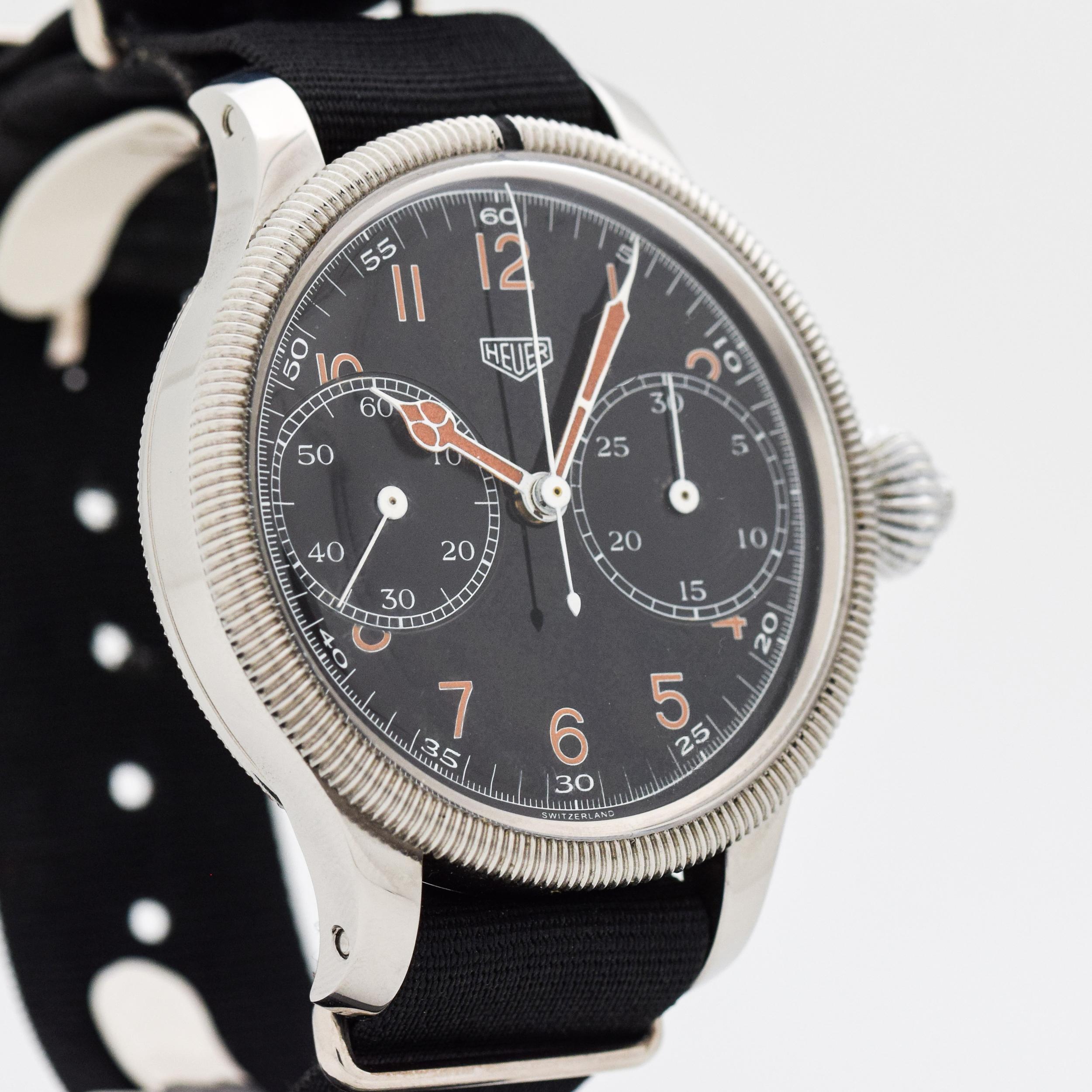 1950's Vintage Heuer Monopoussoir 50 mm Wide One Button 2 Register Chronograph Stainless Steel watch with Original Black Dial with Brown Luminous Arabic Numbers. These Heuer Monoppoussoir watches were Originally a stop watch that we later re-cased.
