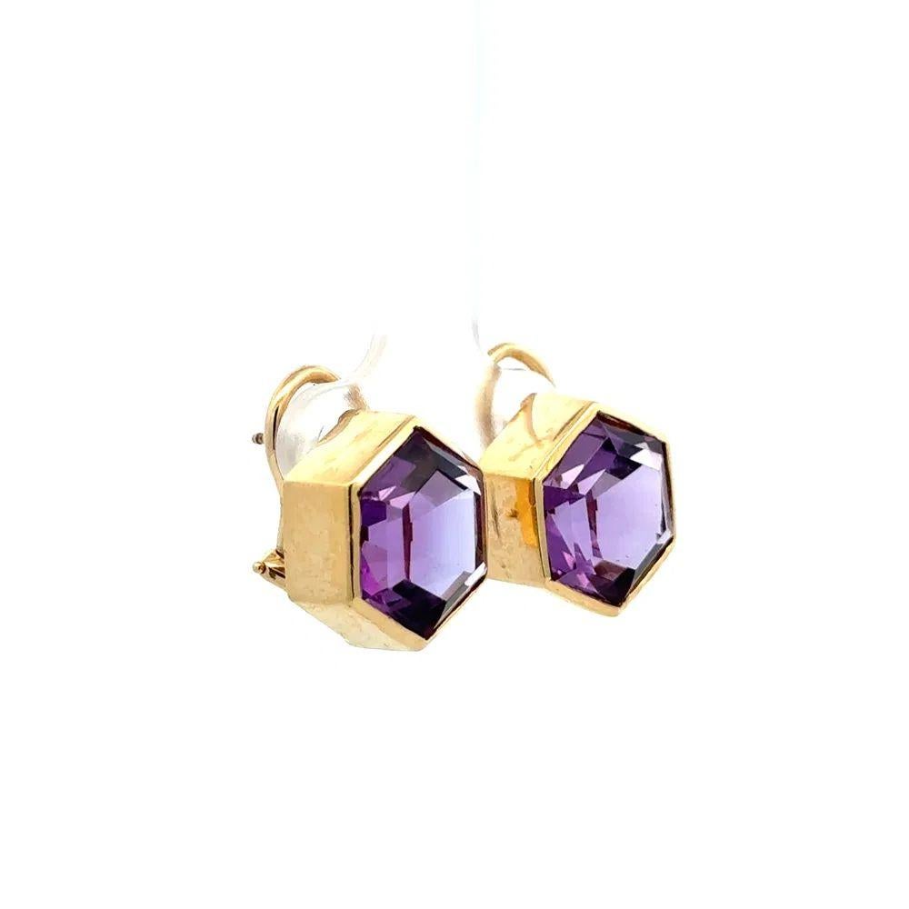 Simply Beautiful! Finely Detailed Vintage Hexagon Amethyst Gold French Clip Earrings. Each earring Hand set with a Hexagon Amethyst, weighing 15tcw for both. Hand crafted in 14K Yellow Gold. Measuring approx. 0.6