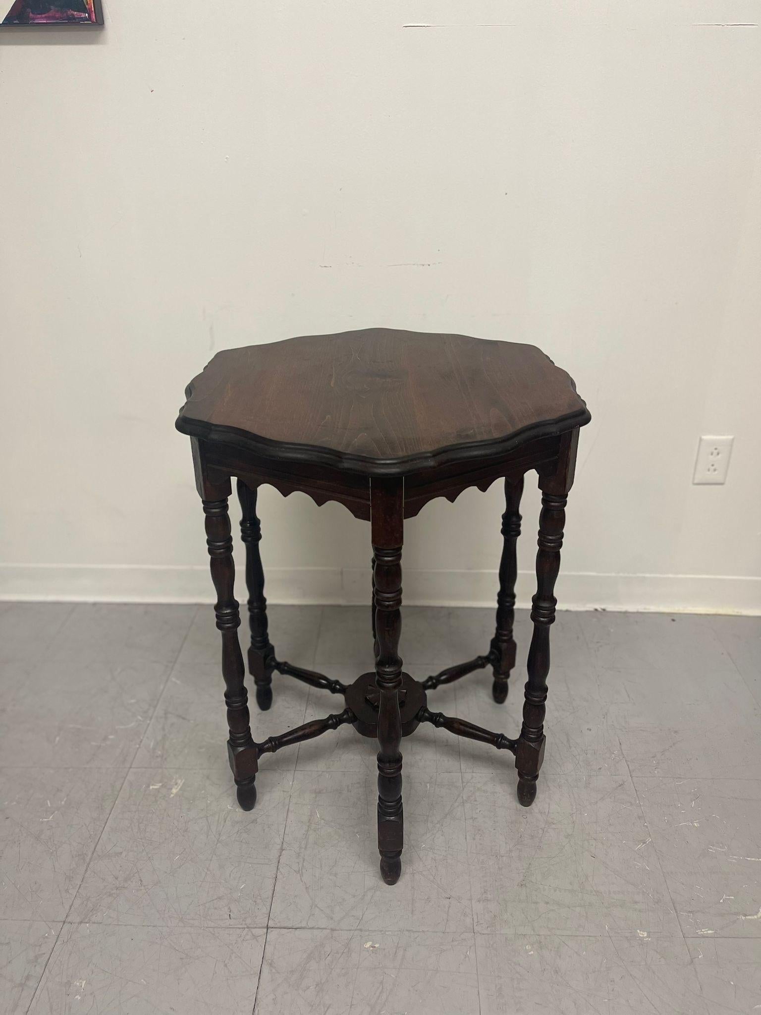 Mid-Century Modern Vintage Hexagonal Carved Wooden Accent Side Table With Scalloped Legs.