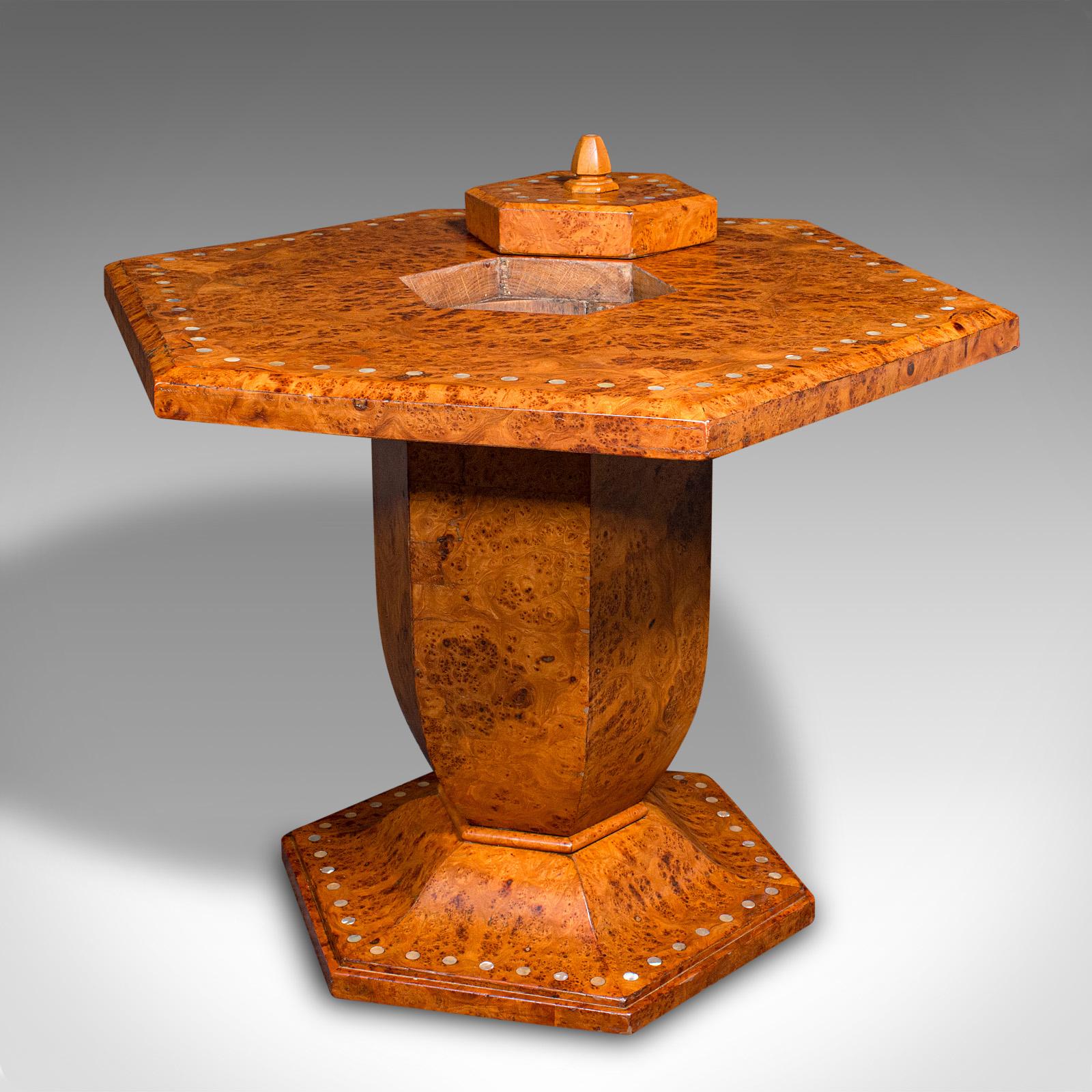 This is a vintage hexagonal coffee table. An English, burr walnut over oak centrepiece table, dating to the Art Deco period, circa 1930.

Exceptional figuring and distinctive form to this fine coffee table
Displaying a desirable aged patina and in