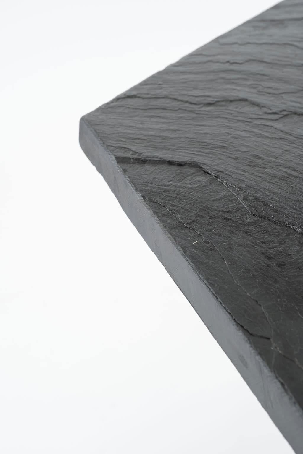 Vintage hexagonal-shaped top slate table from France. Top raised upon two-part slate base.