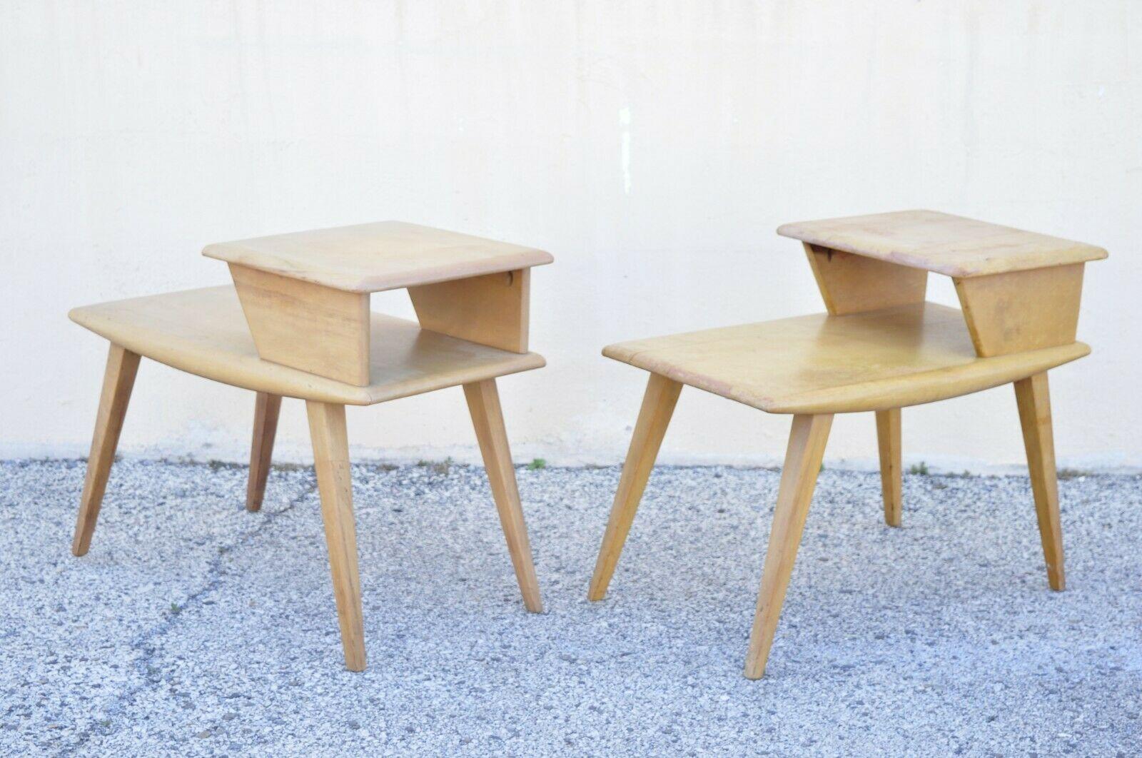 Vintage Heywood Wakefield Birch Maple champagne step end tables - a pair . Item features a solid wood construction, beautiful wood grain, original stamp, tapered legs, very nice vintage pair, great project to bring back to life. Circa Mid 20th