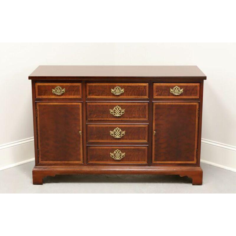 A Chippendale style server by Hickory Furniture, from their American Masterpiece Collection. Mahogany with inlays, brass hardware and bracket feet. Three upper drawers of dovetail construction, center one having a felt lined silverware organizer.