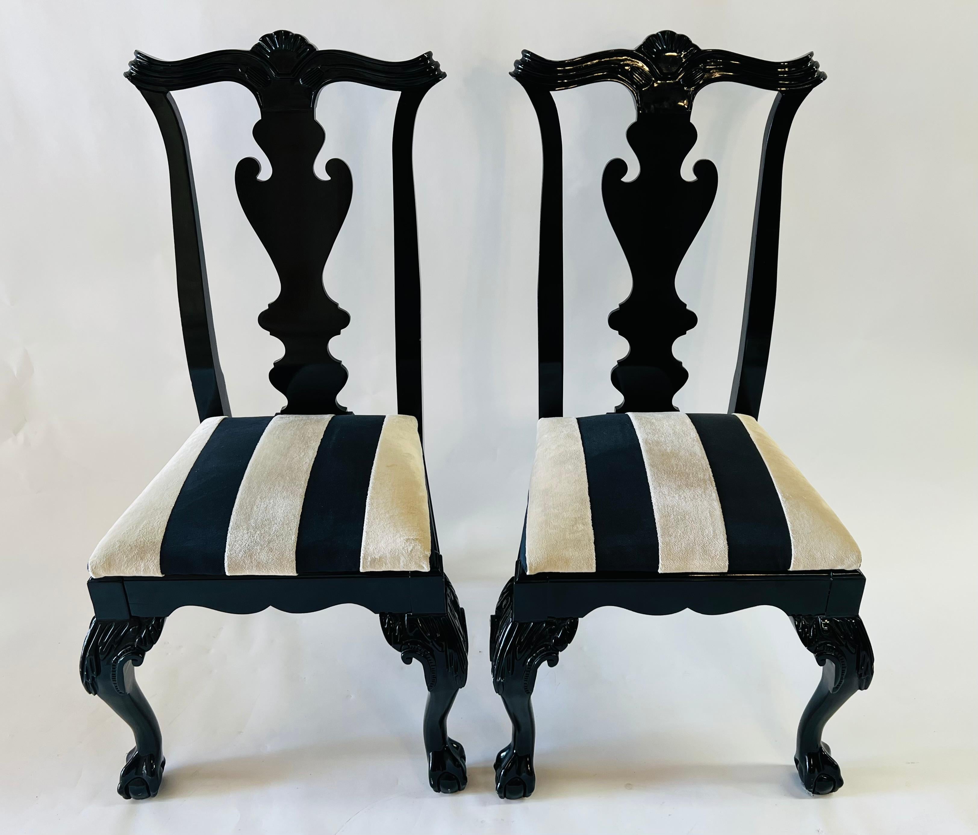 A quality set of 8 Chippendale style dining chairs by Century Chair Company, Hickory, NY. The black lacquered chairs are very stylish in a timeless design fashion. The chairs feature hand carved back design with an acanthus motif in the back and