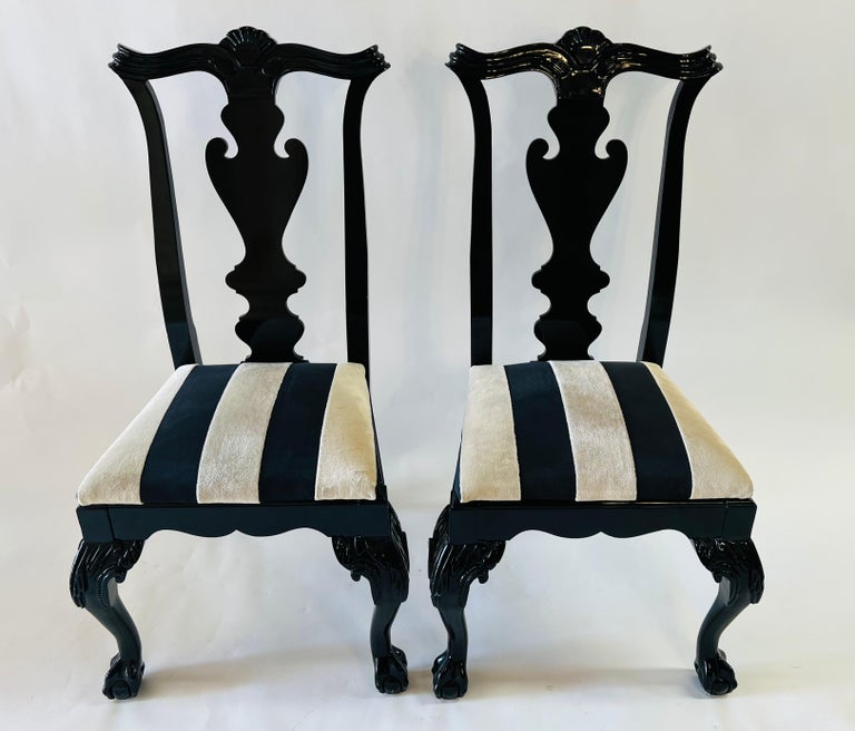 A quality set of 8 Chippendale style dining chairs by Century Chair Company, Hickory, NY. The black lacquered chairs are very stylish in a timeless design fashion. The chairs feature hand carved back design with an acanthus motif in the back and