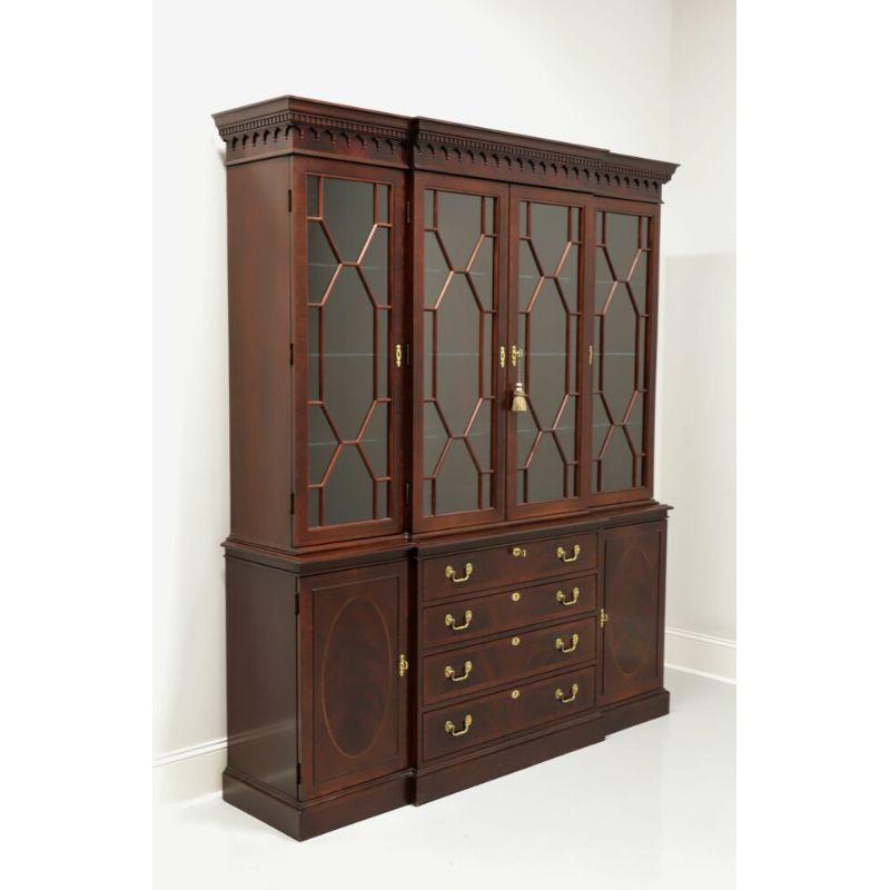 A Traditional style breakfront china cabinet by Hickory Chair, from their Historical James River Plantations Collection. Banded mahogany with brass hardware. Top cabinet is lighted with dimmer switch and has nine adjustable plate grooved glass