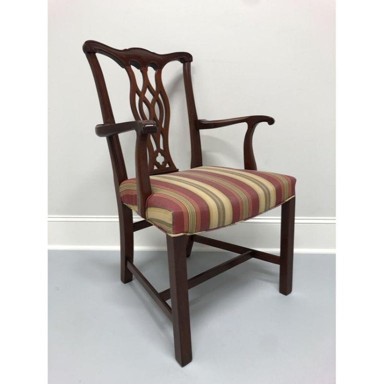 A mahogany dining armchair in the Chippendale style. Made in the USA by Hickory Chair Company in the early 1990s (labels missing). Solid mahogany with straight legs and stretcher base.

Measures: Overall: 23.5 W 23.5 D 38.5 H, Seats: 19 W 17 D 19 H,