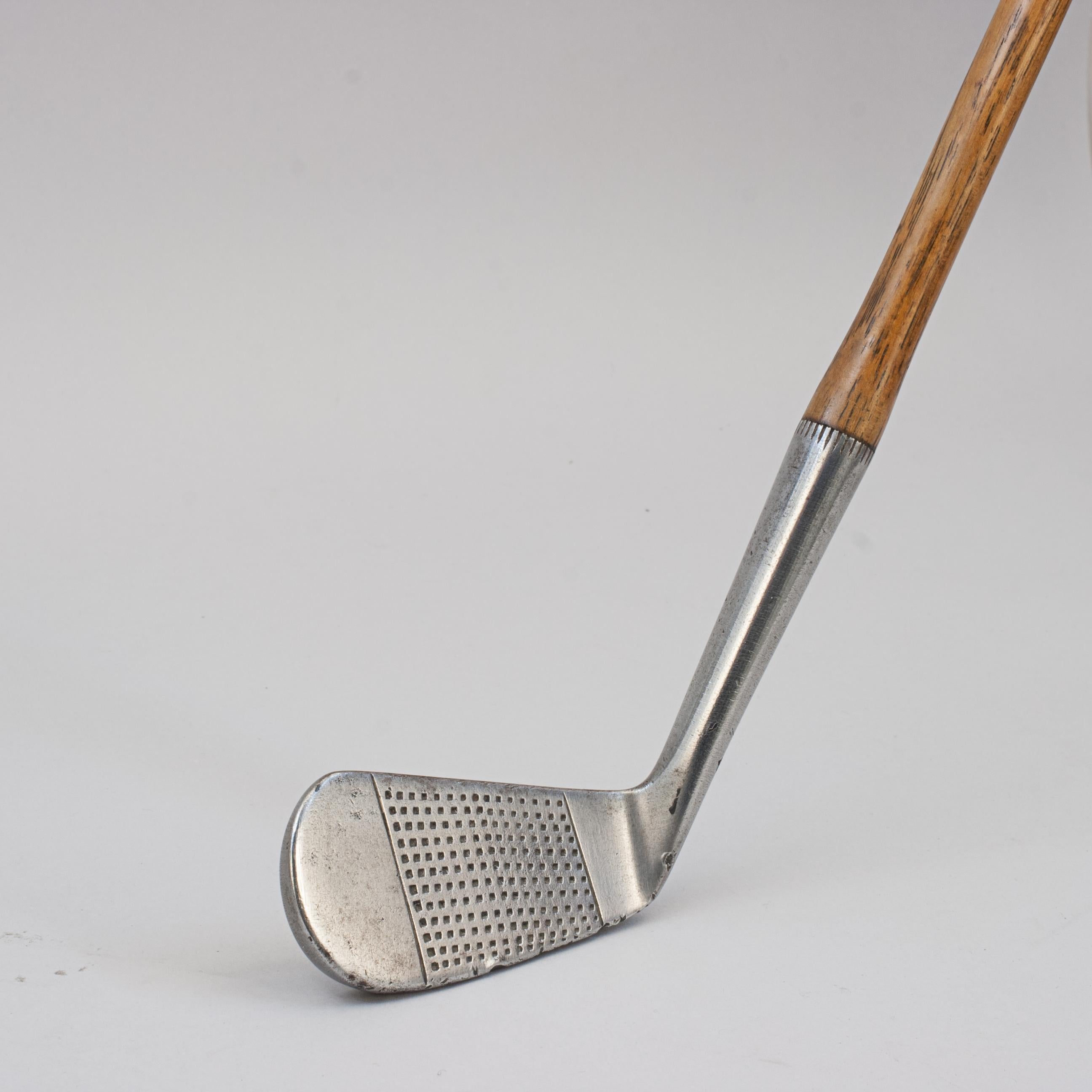 Vintage Hickory Golf Club, Iron, Cann & Taylor.
A nice original hickory blade iron with hand punched dot face markings. The hickory shaft with J. H. Taylor 