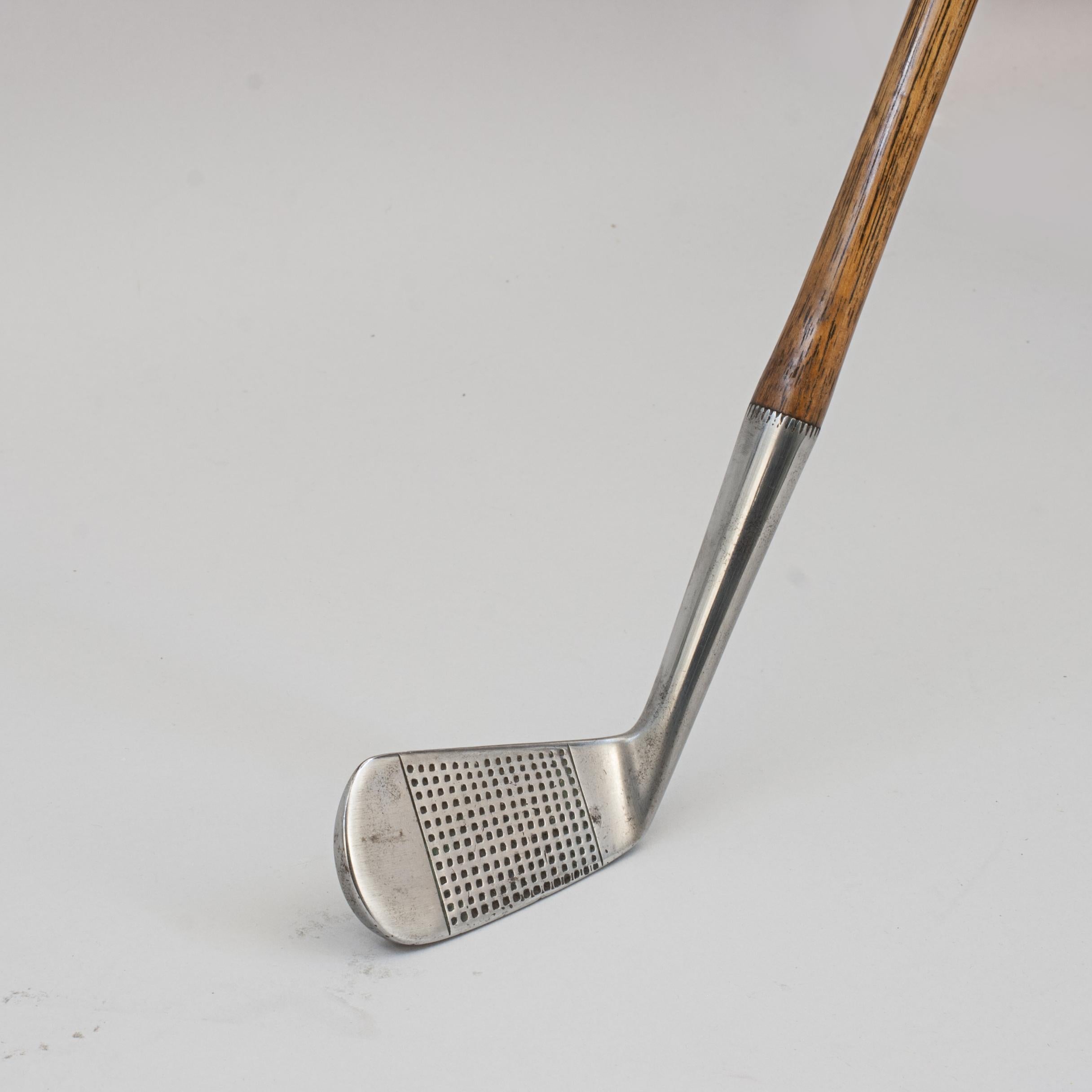 Vintage Hickory Golf Club, Mid Iron.
A fine and nicely weighted dot punched faced mid iron by Josh Taylor (brother of John Henry 