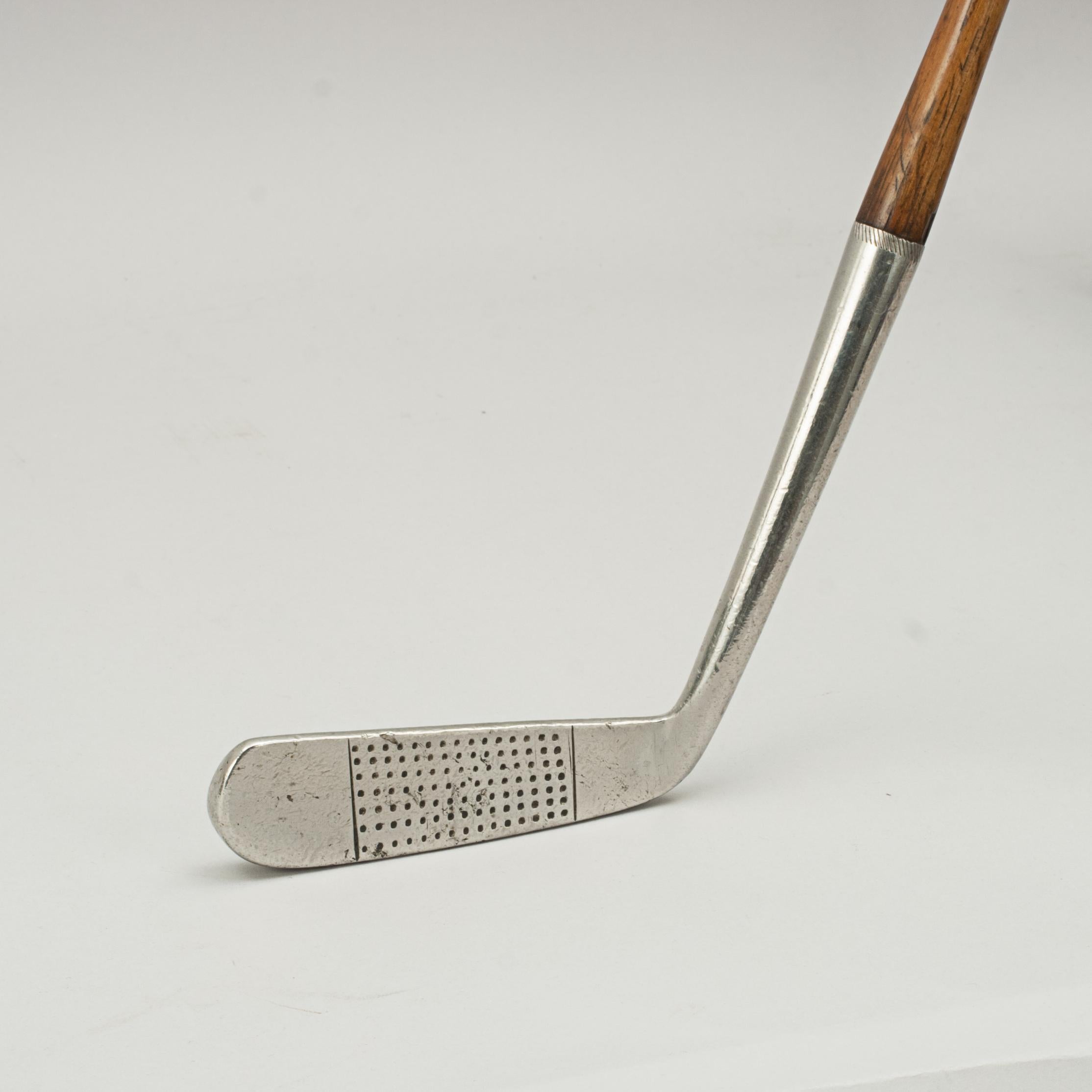 Vintage Hickory Blade Head Putter.
A fine playable hickory shafted putter. The hickory shaft with polished leather grip, the club head is stamped with a 'Terrier' cleek mark and 'Terrier Regd. 17 Putter, Made in Scotland, Special, Rustless', J.
