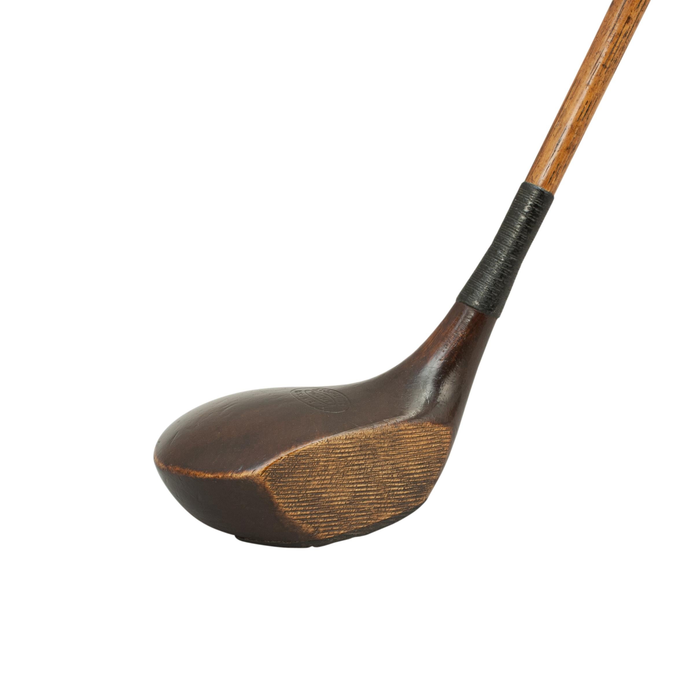 Antique golf club, hickory driver by T. Simpson.
A good original persimmon wood socket head brassie with hickory shaft and new leather grip. The head marked 'T. Simpson, Special, Southport'. The club head has a leading edge horn insert and lead