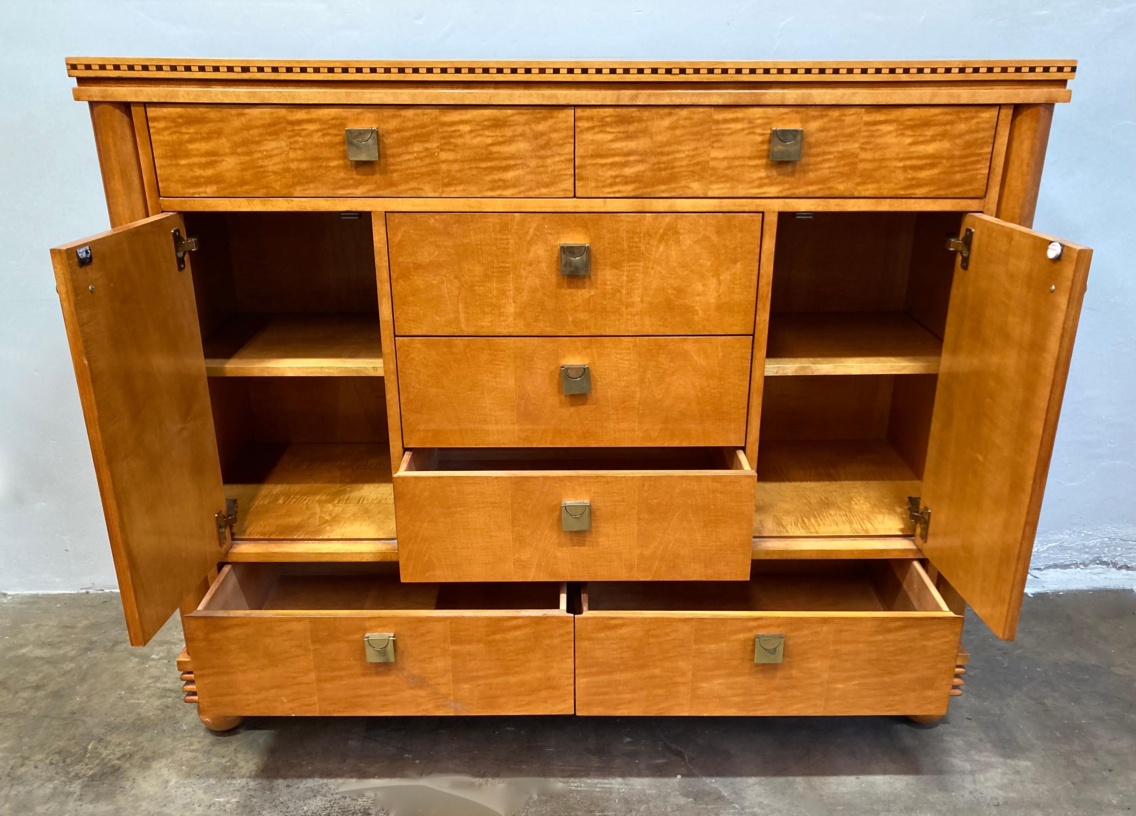 Lovely vintage Hickory White Genesis Collection high-boy cabinet/dresser. Dresser is made of tiger maple wood and has pillared corners. Edges have alternating wood joinery trim and elegant brass pulls. This dresser has 7 pull-out drawers, and two