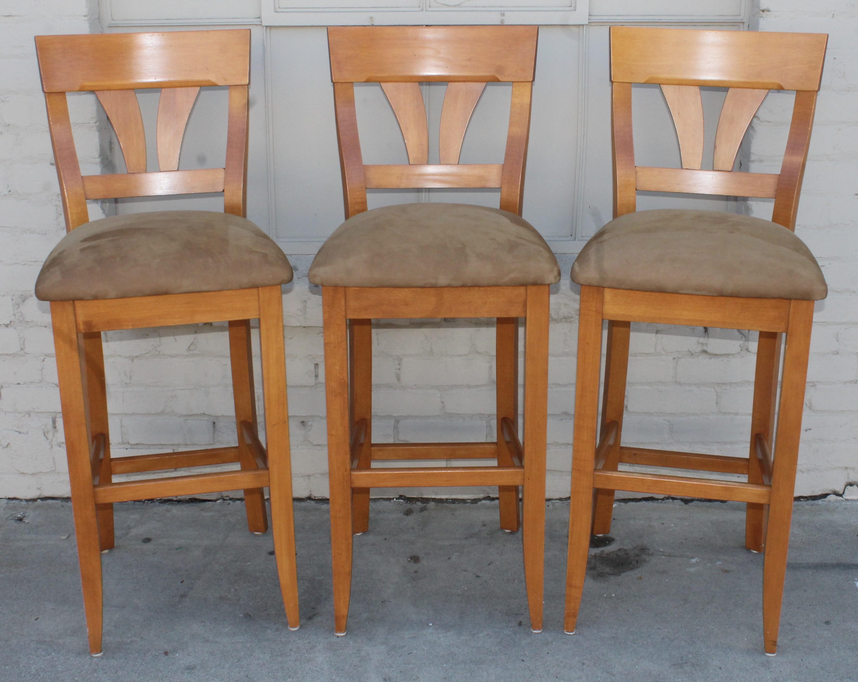 These high back maple bar stools are newly upholstered in high grade quality Italian suede. They are very sturdy and comfortable. The condition is perfect.