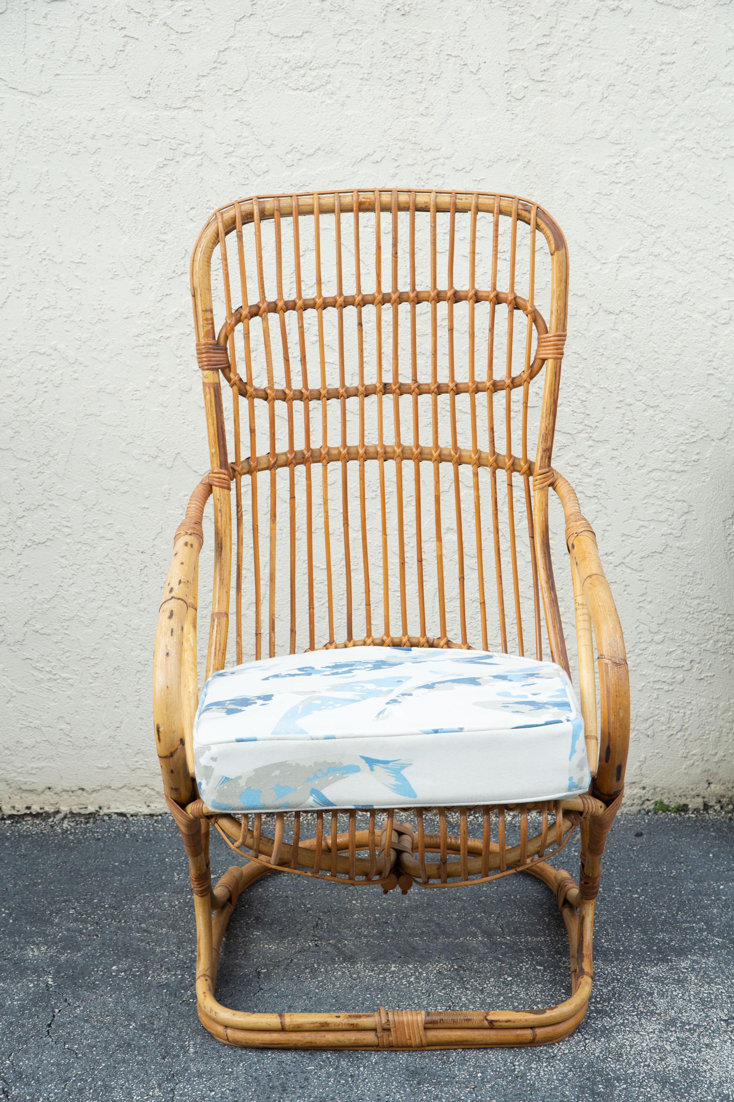 Vintage high back cane armchair with plenty of details and cushion.