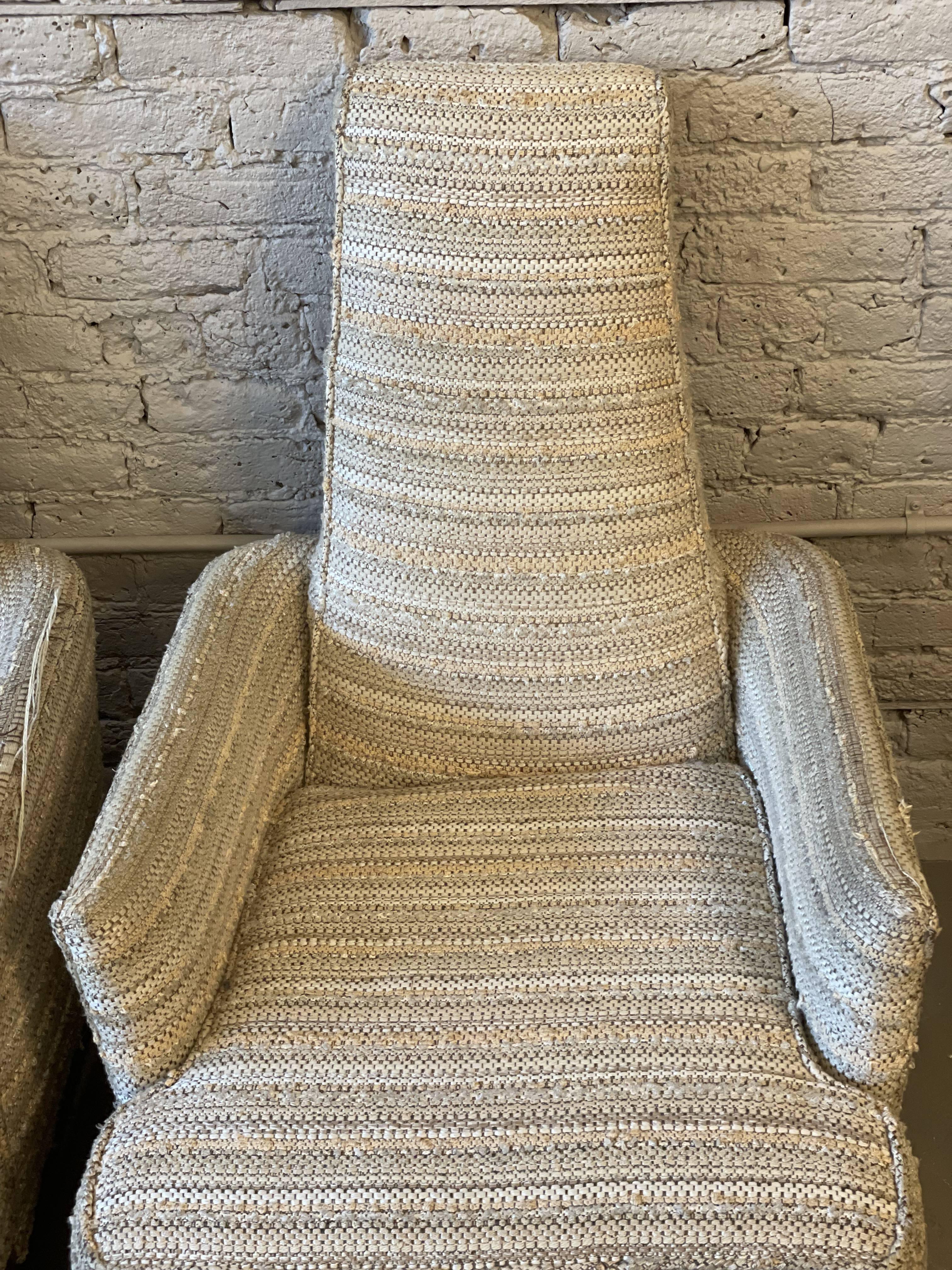 Ooh the lines of these chairs are super cool. The seat is deep and very comfortable. Please look at the picture showing the back view, the negative space is stunning. Reupholstery suggested.

Dimensions: 27