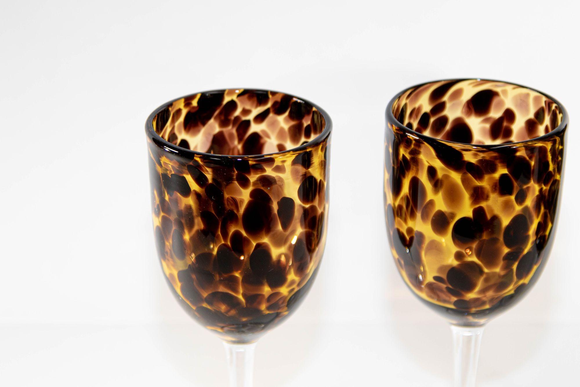 Vintage amber drinking footed glasses set of 3 mouth-blown with exclusive tortoiseshell color flowing pattern.
A distinctive tortoise shell motif brings rich color and dimension to a glass barware set that makes a stunning addition to your