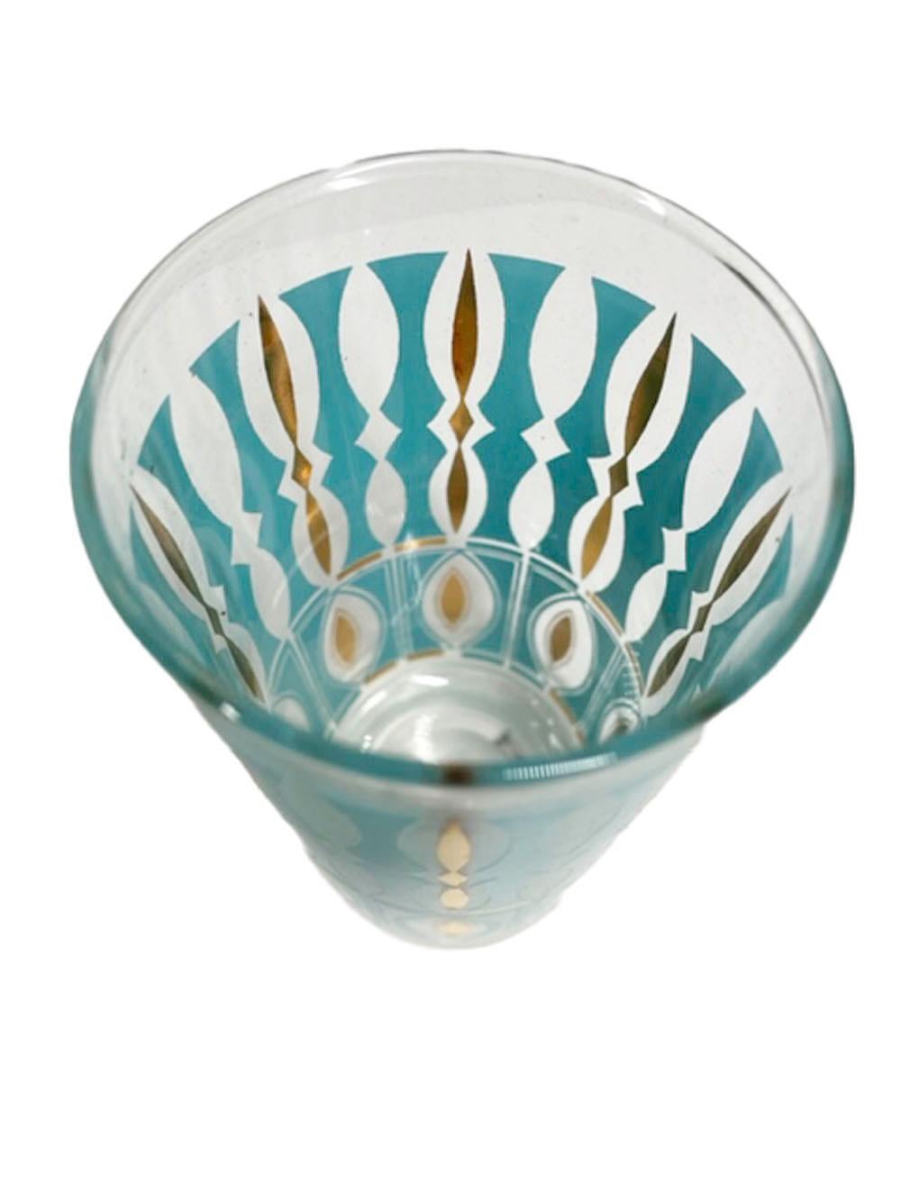 Eight Mid-Century Modern highball glasses by Anchor-Hocking with aqua enamel in a balustrade pattern with 22 karat gold conforming to the spaces between the balusters.