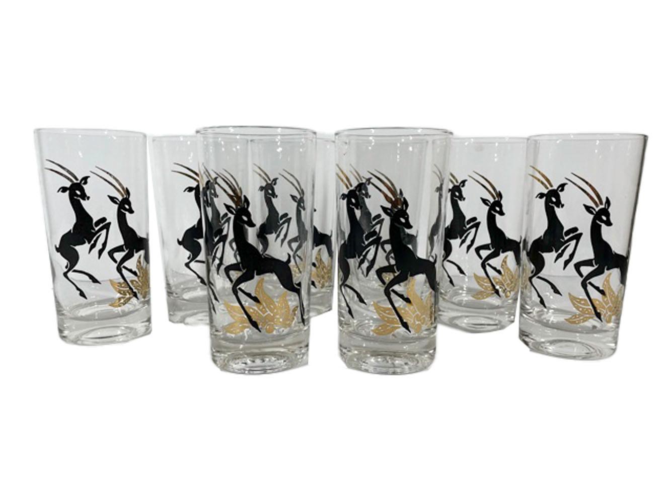 Set of 8 mid-century modern highball glasses with 2 stylized antelopes in black enamel with 22k gold horns.