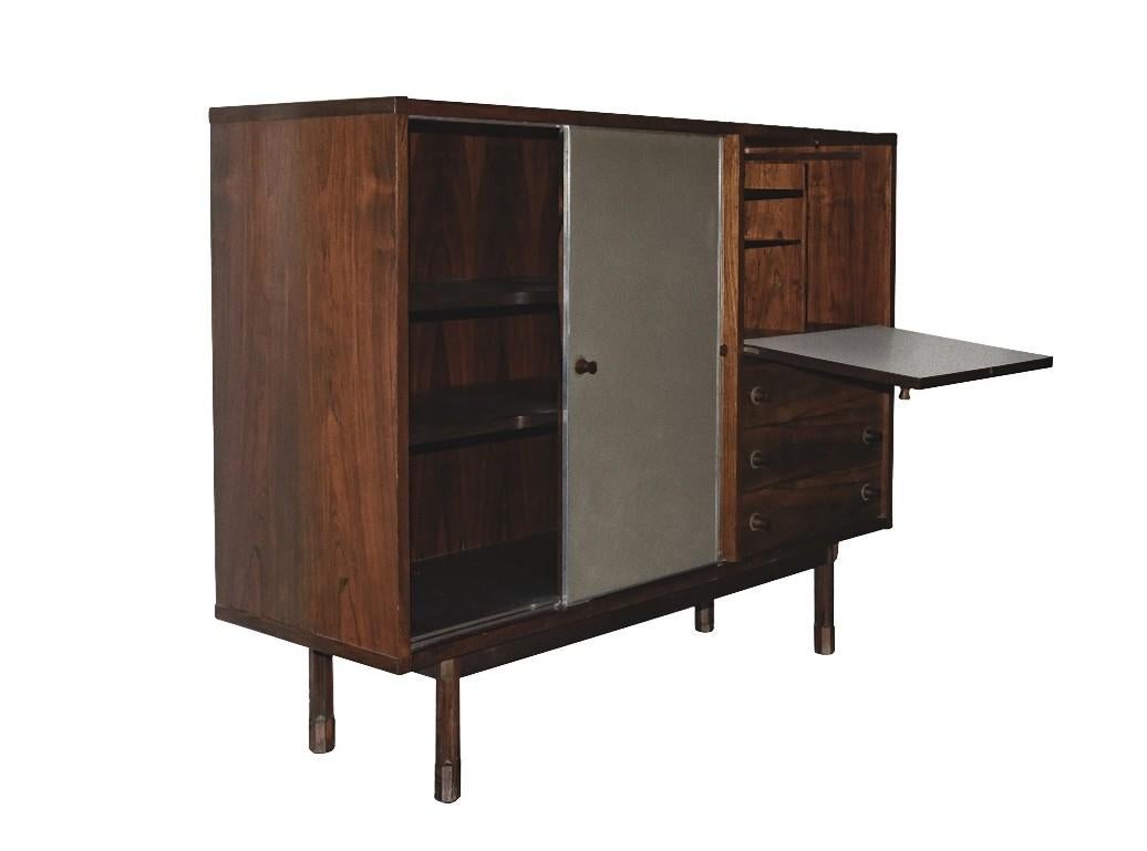 Coslin highboard is an original design work realized in the 1960s by the designer Georges Coslin. 

Created by Georges Coslin for 3V, Padua. Made in Italy.

Solid teak structure, with rosewood and aluminum finishes.

Very good conditions. 

