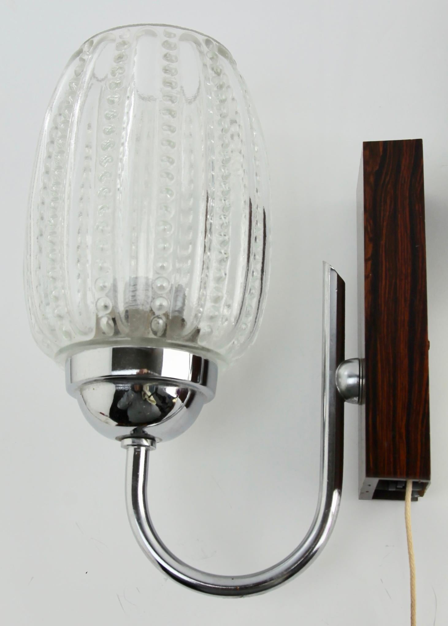 Vintage 1 arm pair of wall mount lamp, the 1960s.
Hillebrand Germany.
Factory in light fixtures was founded by Egon Hillebrand in 1881, who was originally a foliage grower and installer. 
The factory was located in Neheim, Germany