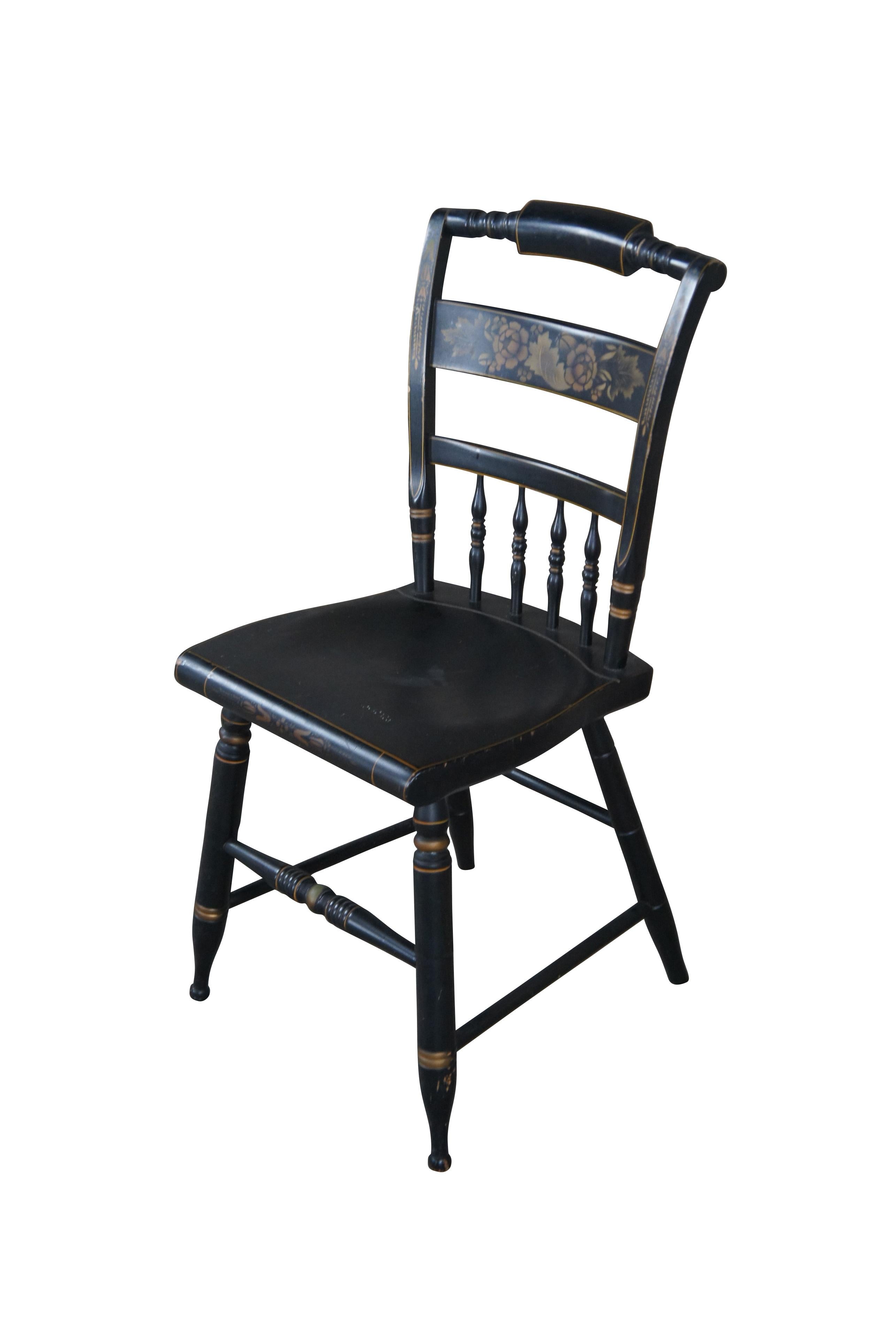 Mid-20th century Hitchcock stenciled farmhouse chair. Features a floral and leaf / foliate design with ribbed and slatted accents.

Dimensions:
17