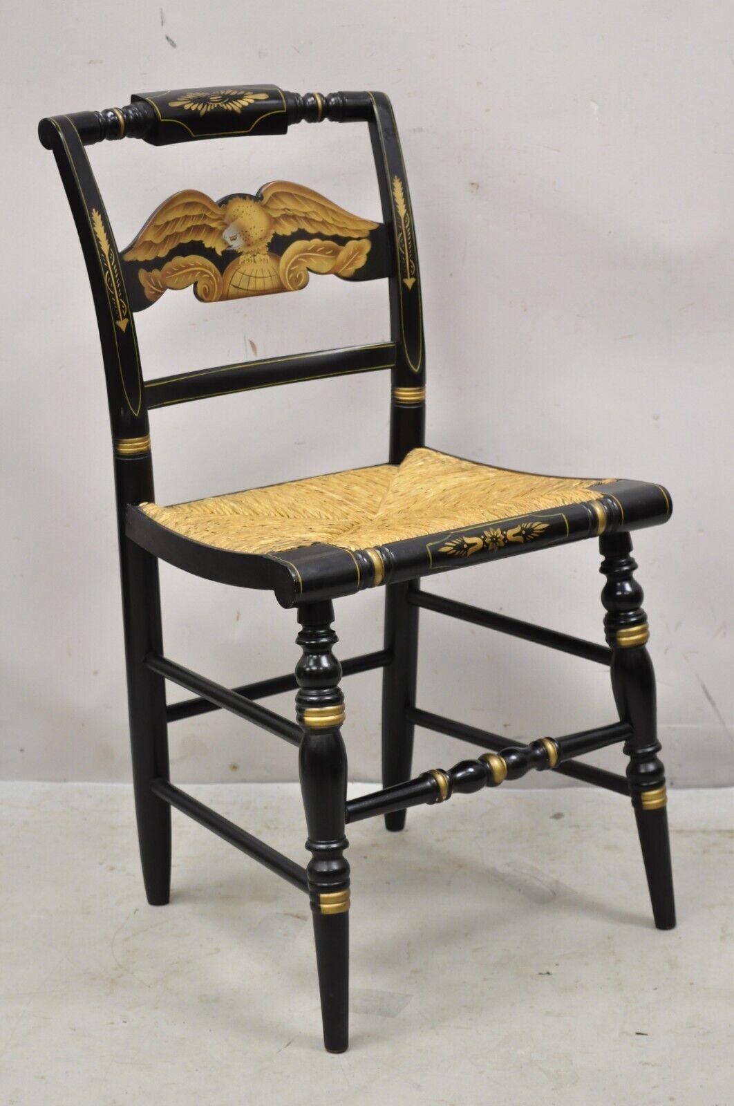 Vintage Hitchcock black side chair with gold eagle rope cord seat. Item features a woven rope cord seat, black painted finish, gold stencil painted eagle, solid wood frames, original signature, quality American craftsmanship, great style and form,