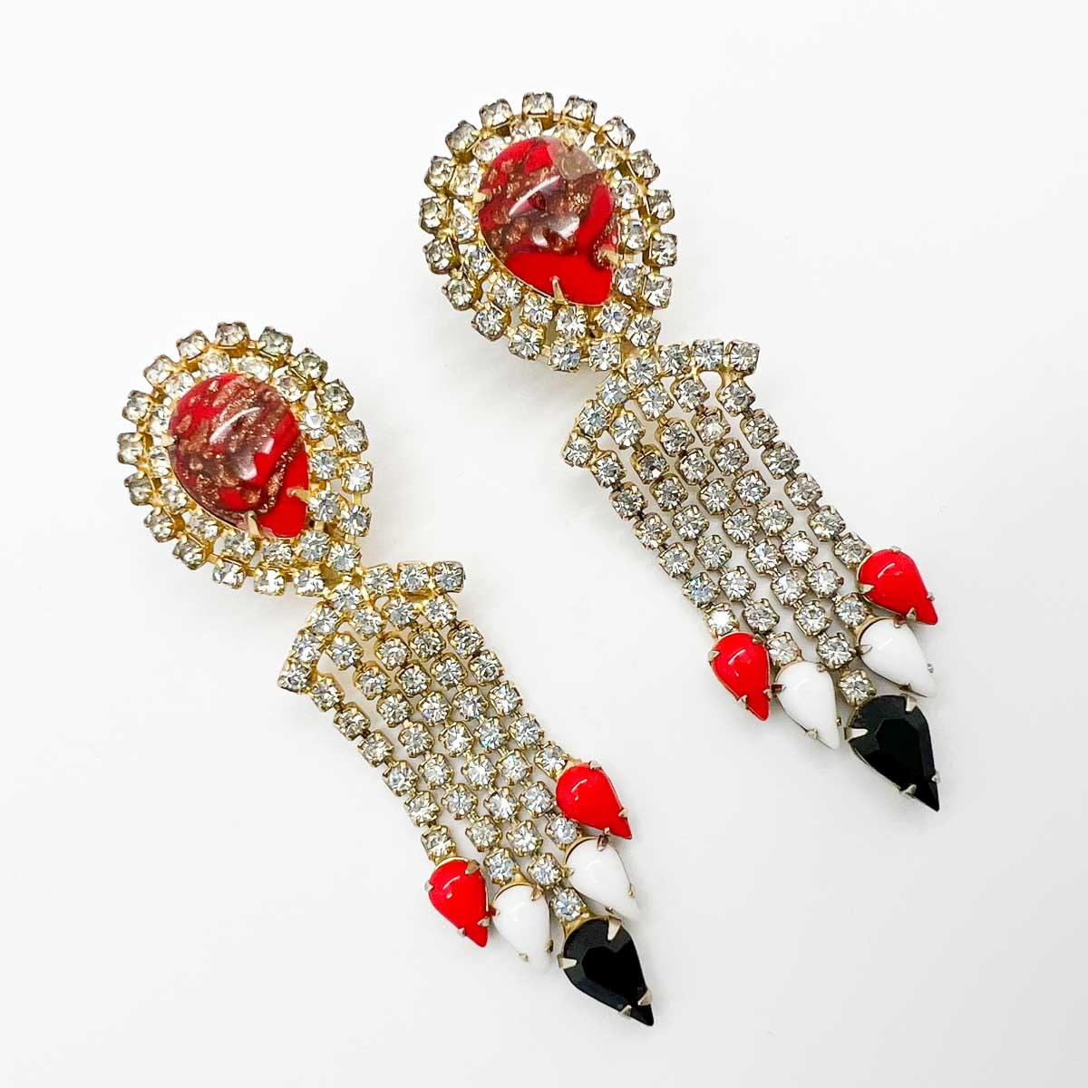 A fabulous pair of 1960s vintage Hobe Chandelier Earrings. The perfect bright and impactful chandelier earring. The attention to detail making these beauties a true work of wearable art.
Hobé jewellery has a timeless and legendary splendour with an