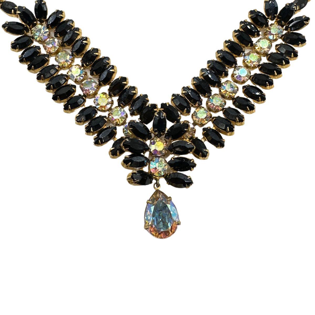 A Timeless, One-of-a-Kind Hobe Bracelet
This vintage Hobe bracelet stands as a testament to exceptional craftsmanship and timeless elegance. Designed with a striking feather-like pattern, the piece features nearly 60 opaque black rhinestones, each