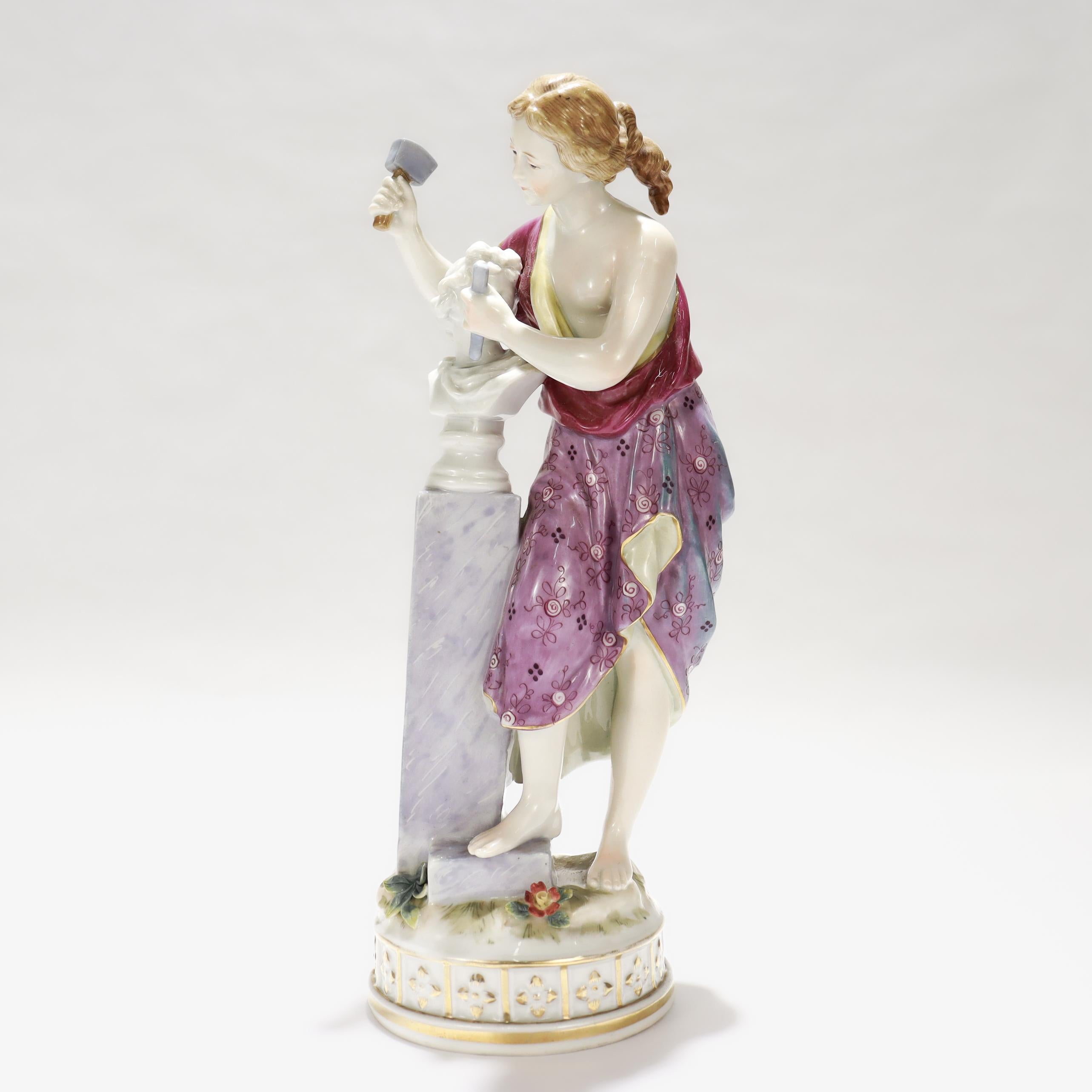 A fine vintage German porcelain figurine. 

In the style of Höchst Porcelain.

In the form of a woman in toga sculpting a marble bust atop a plinth.

Signed in the plinth for the artist H Rock and marked to the base with a Hochst type maker's