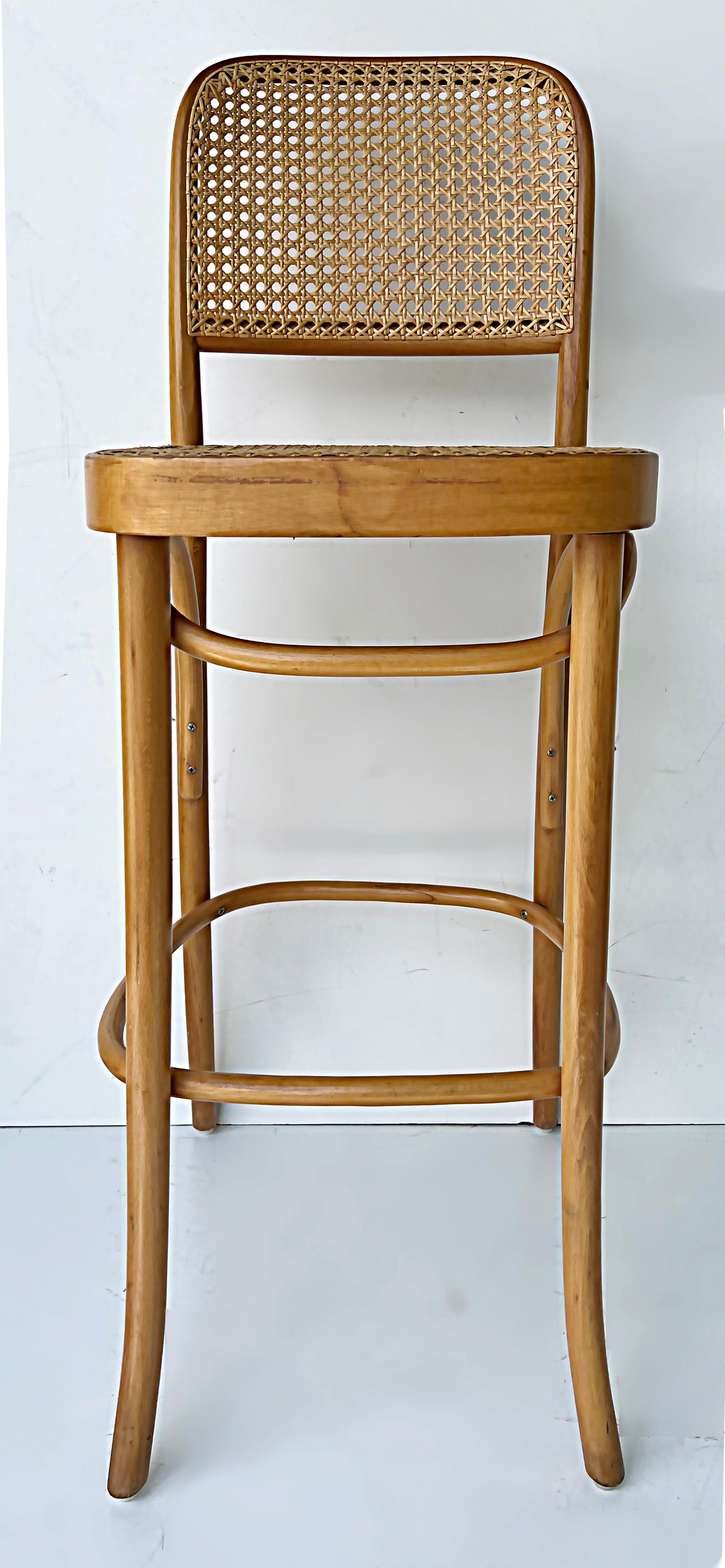 Vintage Hoffmann bentwood thonet bar stools, set of 3 

Offered for sale is a set of 3 vintage modern beech wood 811 Thonet bentwood bar stools by Josef Hoffmann with hand-caned seats and backs. Hoffman's original 811 chair design was from 1930