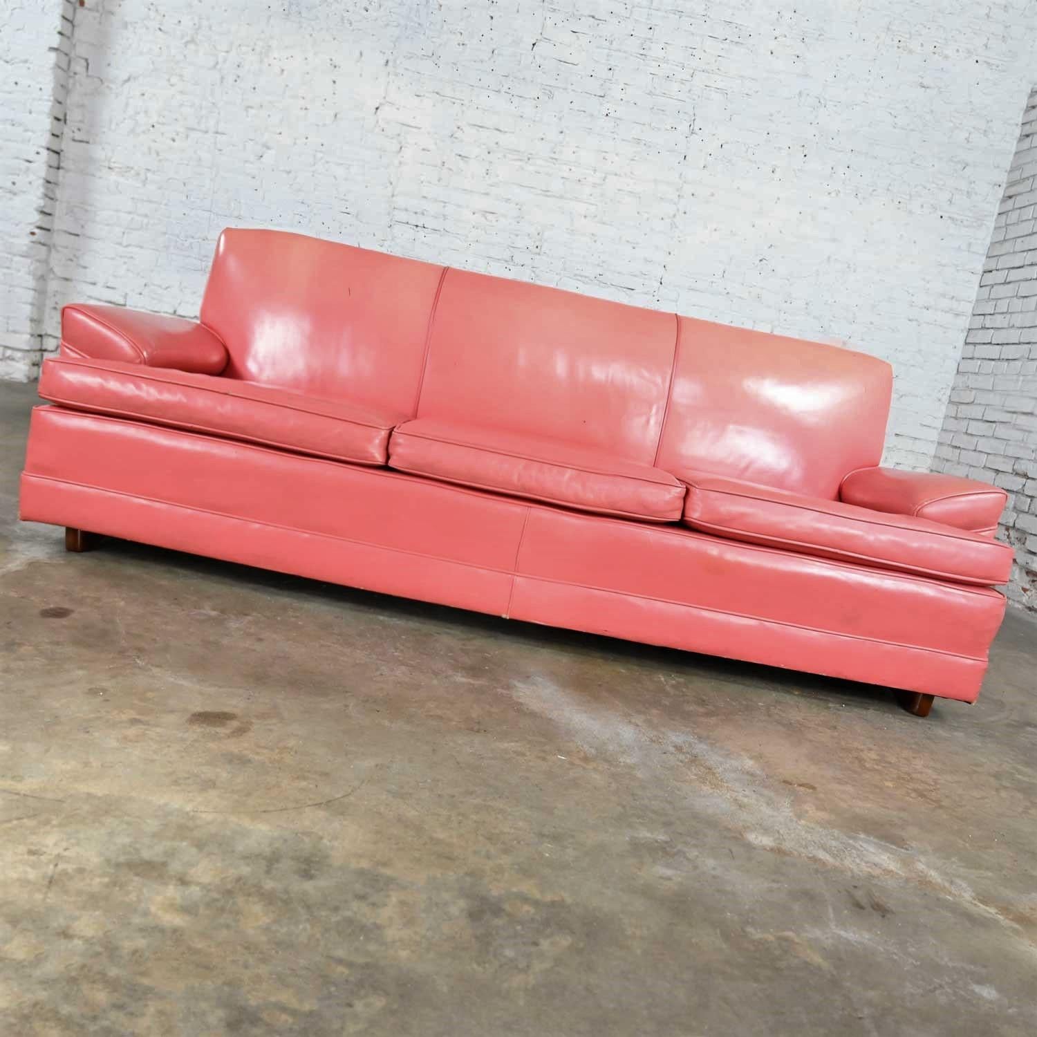 Fantastic vintage Hollywood Regency Art Deco sofa with original pink leather and three loose seat cushions. Beautiful condition, keeping in mind that this is vintage and not new so will have signs of use and wear. There is a lot of wear, pinholes,