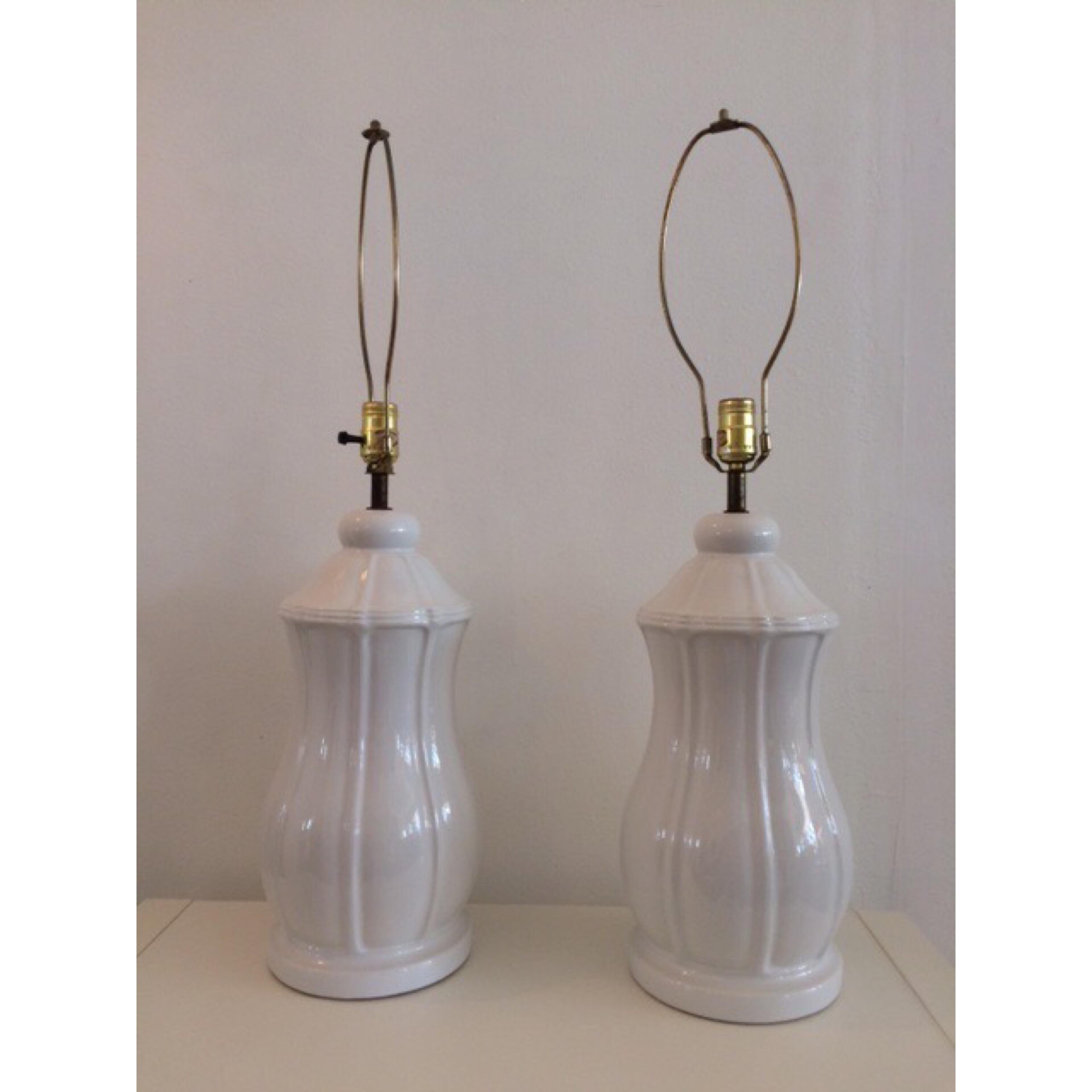 A very special pair of vintage Hollywood Regency blanc ceramic table lamps. This is a one of kind hand made set. A great addition to any room.