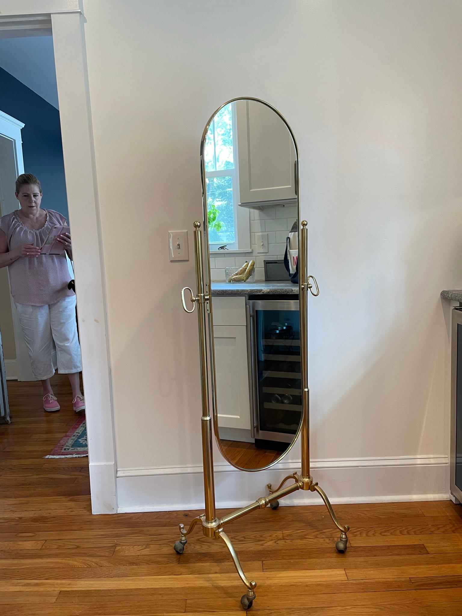 Beautiful full length floor mirror. Racetrack mirror tilts for versatility and caster wheels for easy positioning. Clean simplistic lines blend with multiple decor. Classic!.