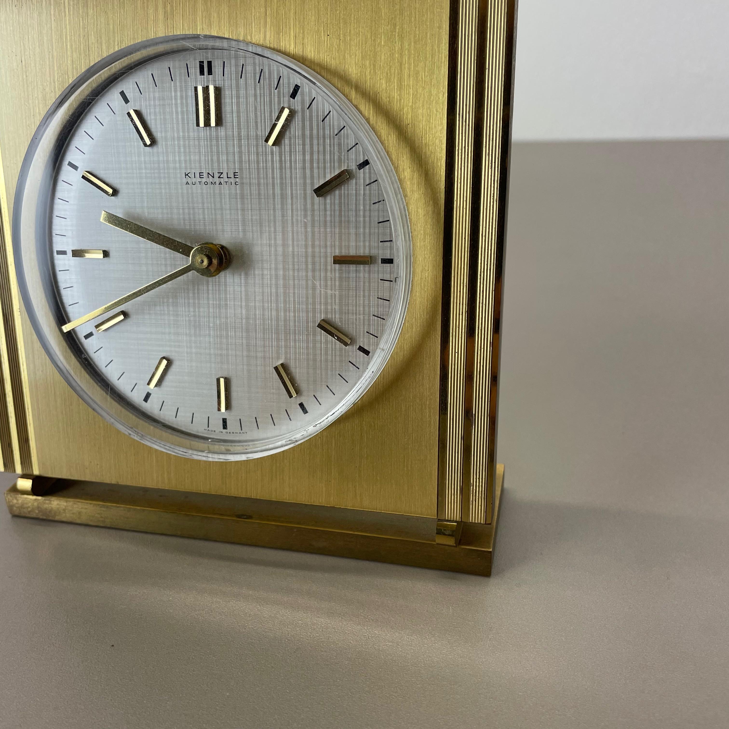 Mid-Century Modern Vintage Hollywood Regency Brass Glass Table Clock by Kienzle, Germany 1960s For Sale